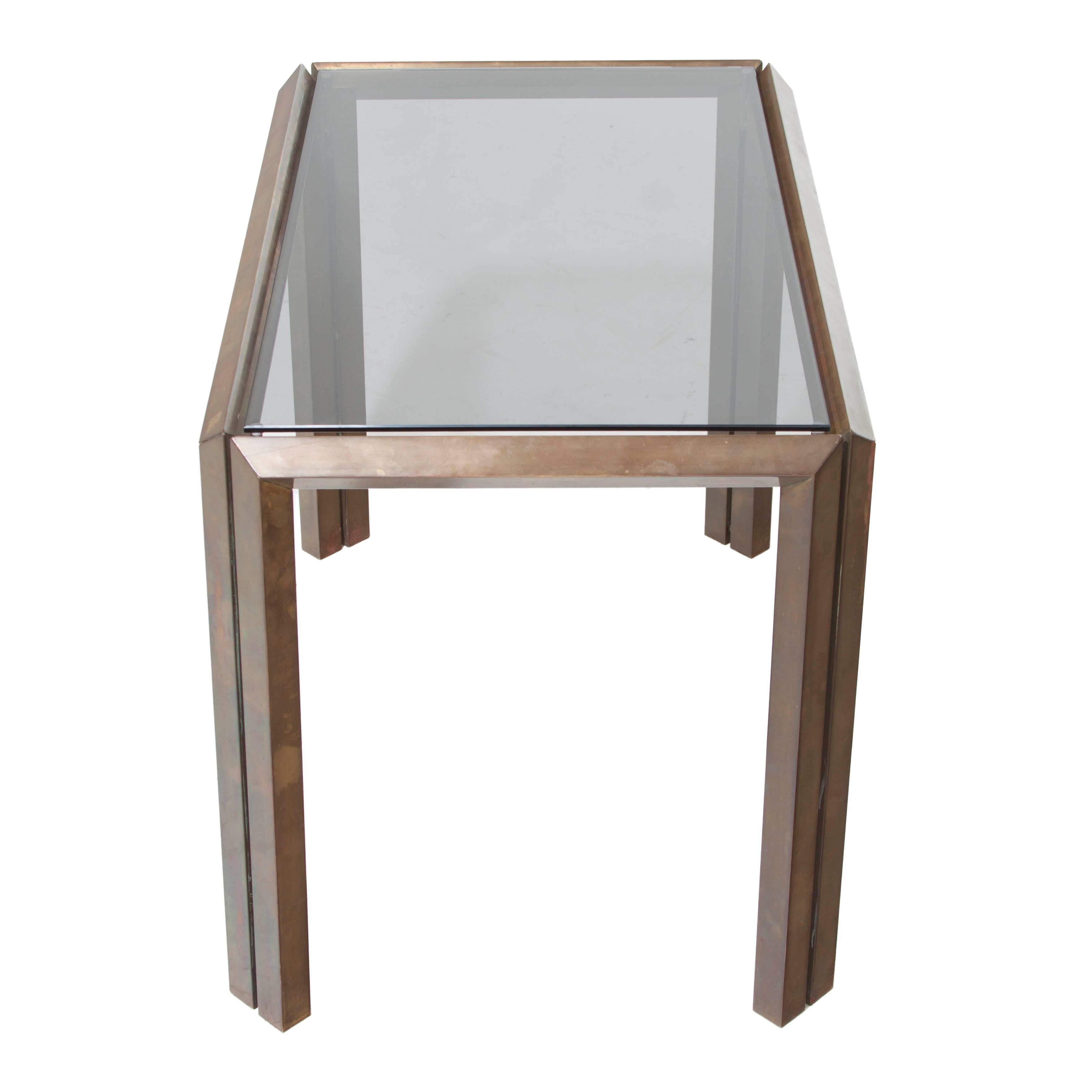 Unique bronze side table with smokey grey glass top. Polished to retain beautiful Mid-Century patina.
