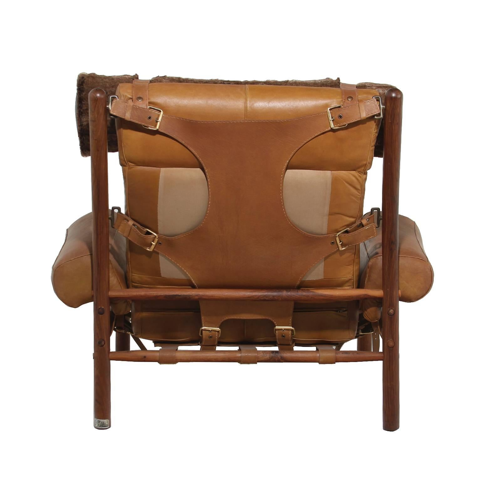 Mid-20th Century Armchair and Ottoman with Cognac Leather and Faux Fur Pillow by Arne Norell