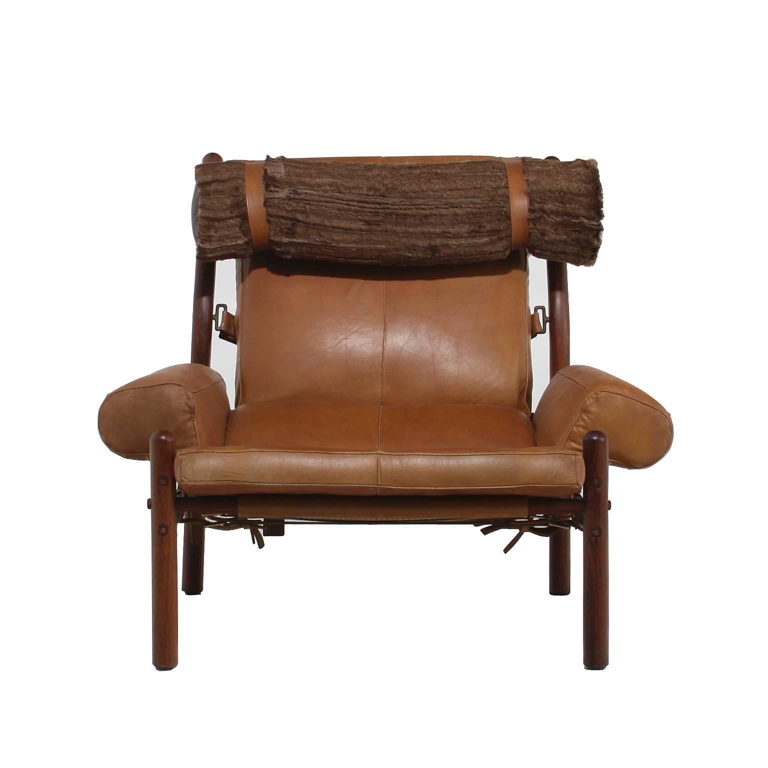 Impressive armchair and ottoman with cognac leather and faux fur pillow by Arne Norell.

Seat height: 35.
Seat depth: 36.

Many pieces are stored in our warehouse, so please click on CONTACT DEALER under our logo below to find out if the pieces