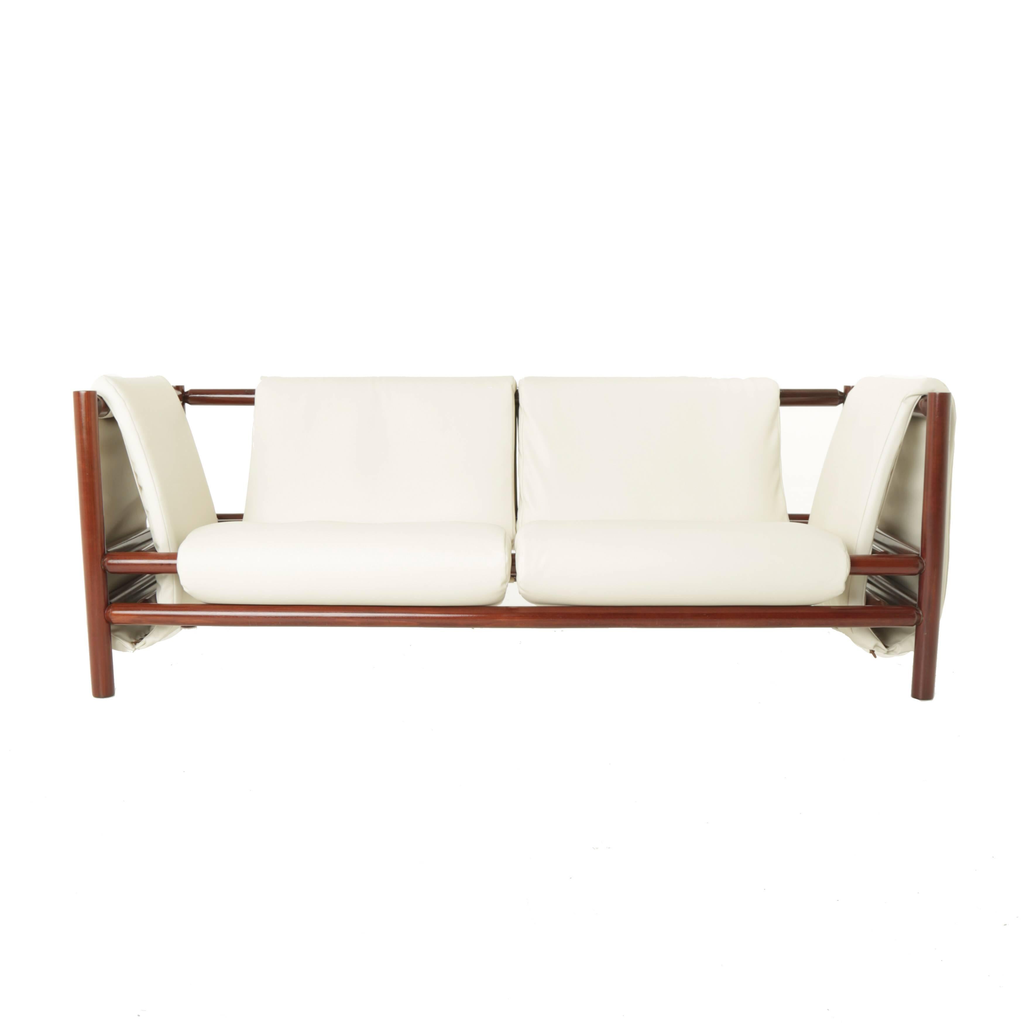 Beautiful Brazilian Loose Mantle sofa is Solid Pau Ferro by Joaquim Tenreiro

Acquired from from the Bloch Editores publishing house in a bankruptcy auction in the early 2000s.

Many pieces are stored in our warehouse, so please click on