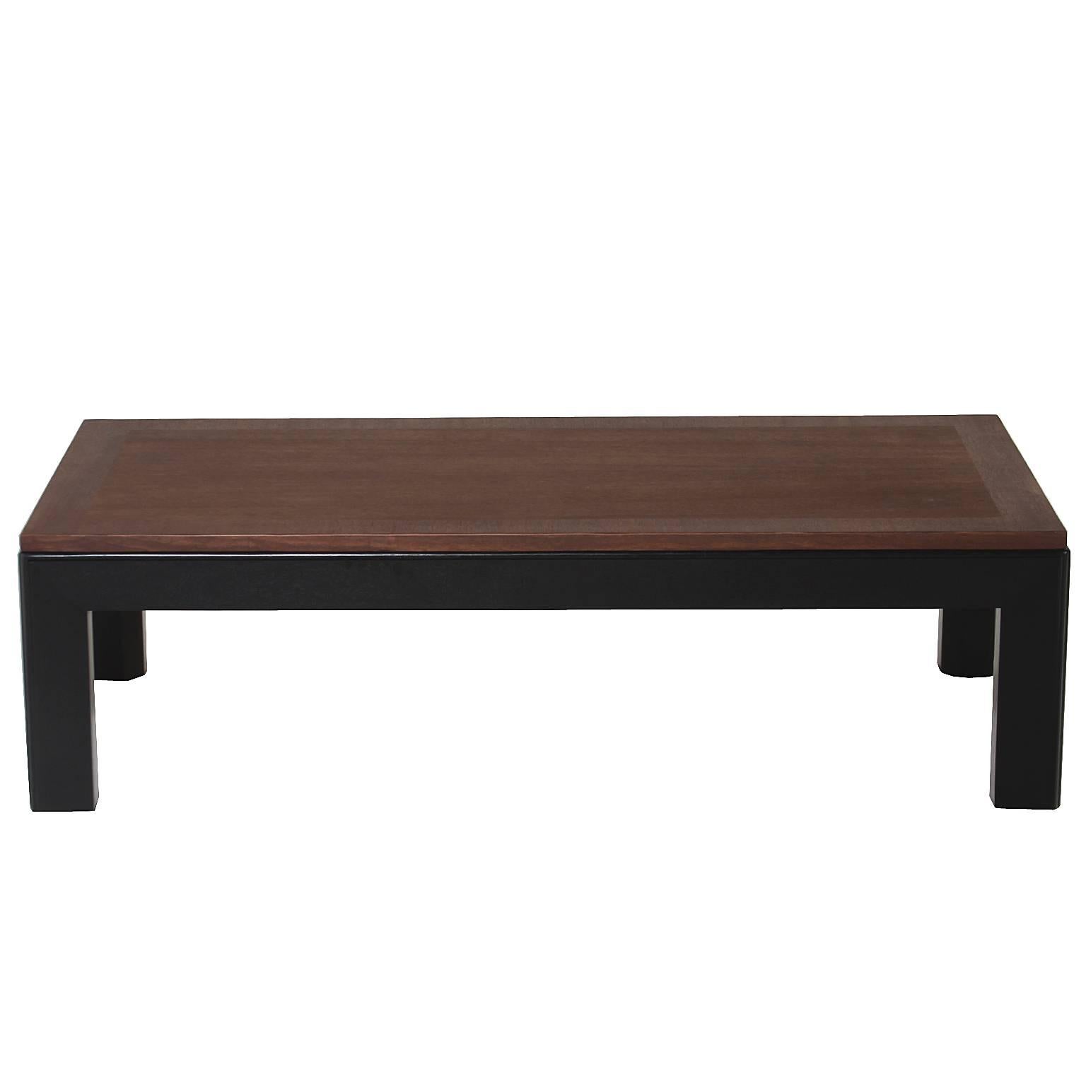 This Widdicomb rectangular coffee table has a newly finished mahogany top with a chocolate oil finish which sits upon an ebonized satin lacquer base. 

Many pieces are stored in our warehouse, so please click on 