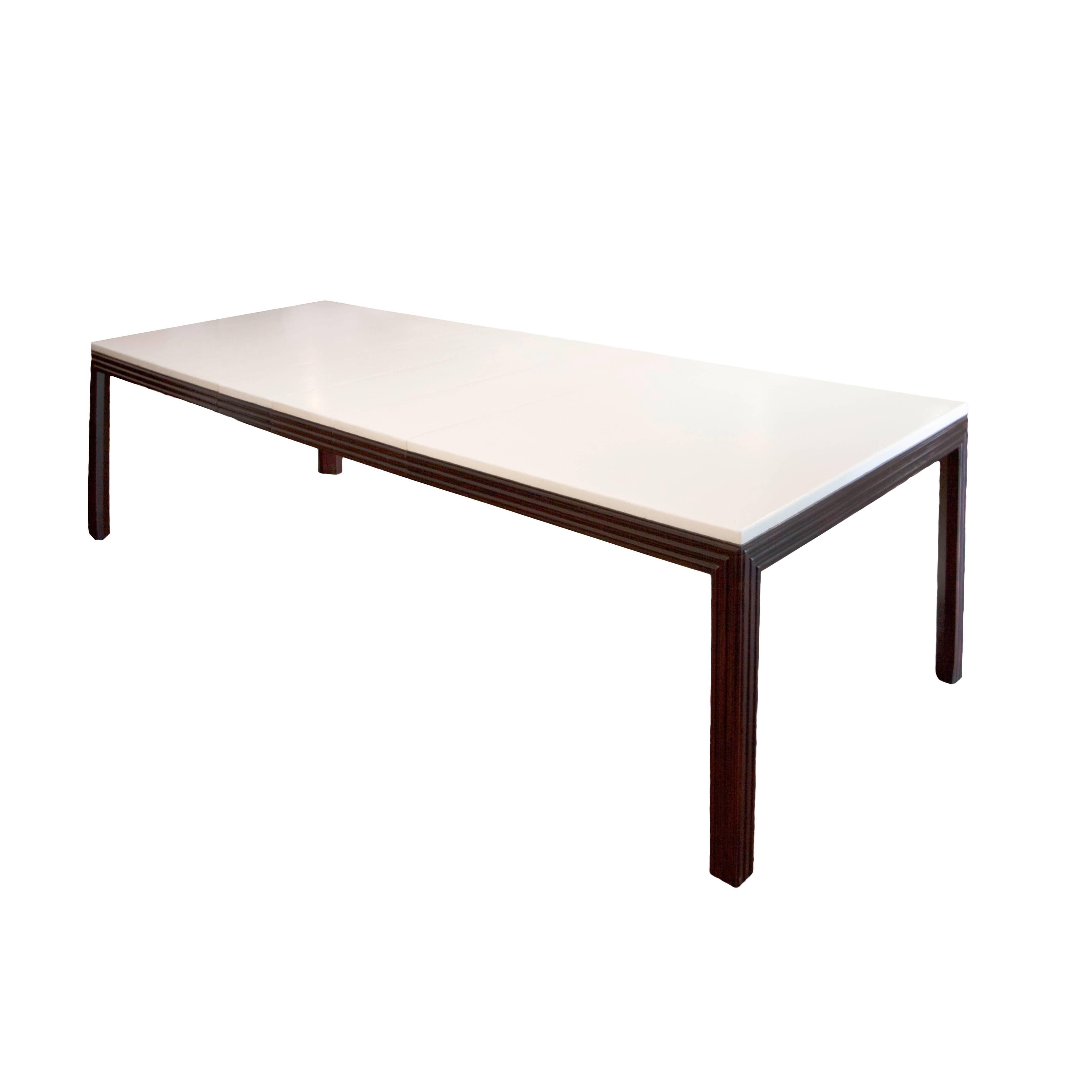 Paul Frankl mahogany table with lacquered cork top for Johnson Furniture Co., model no. 2263. Table comes with three 11 in. leaves that extend the table to 105 in.