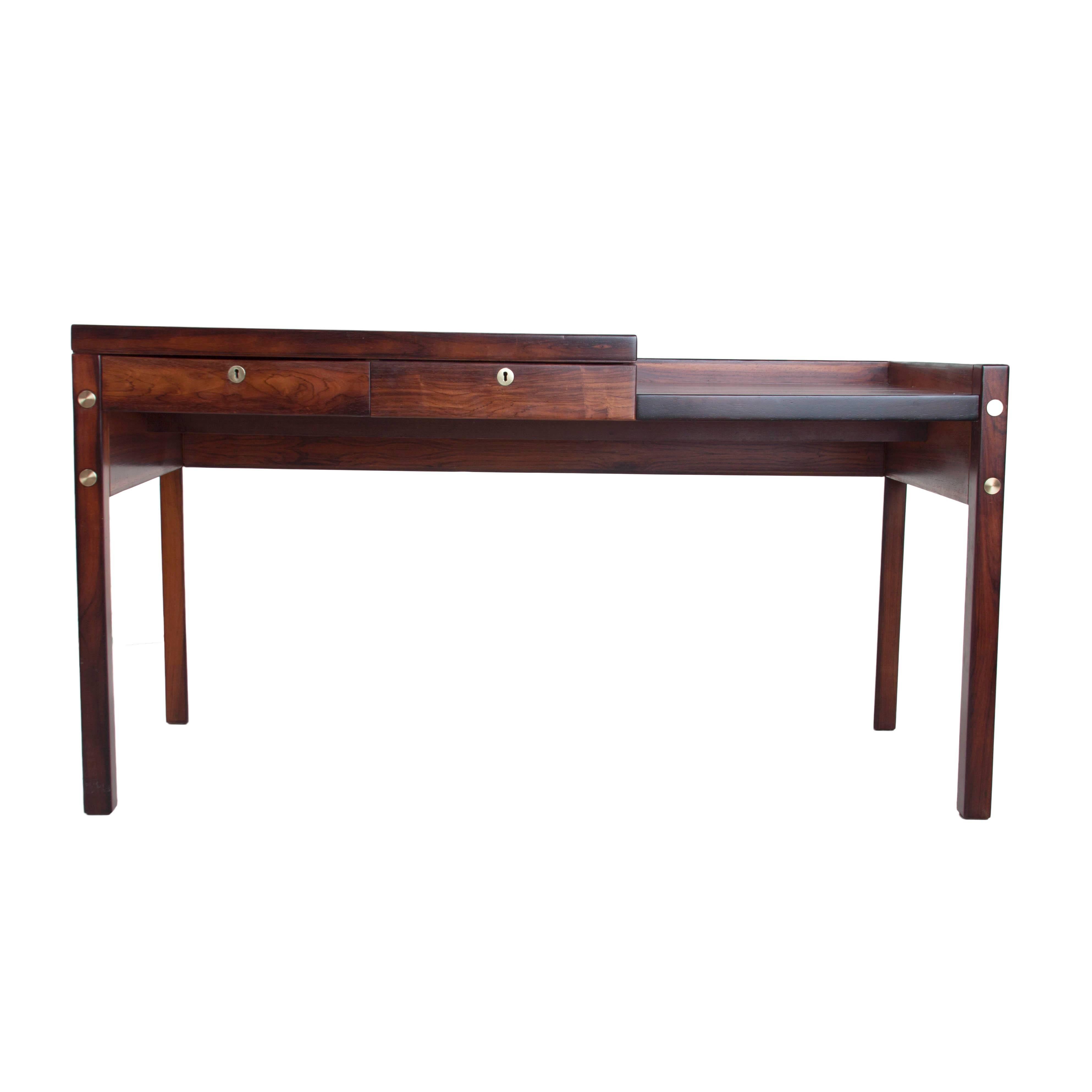 Beautifully crafted Sergio Rodrigues multi-level desk in rosewood with brass details.