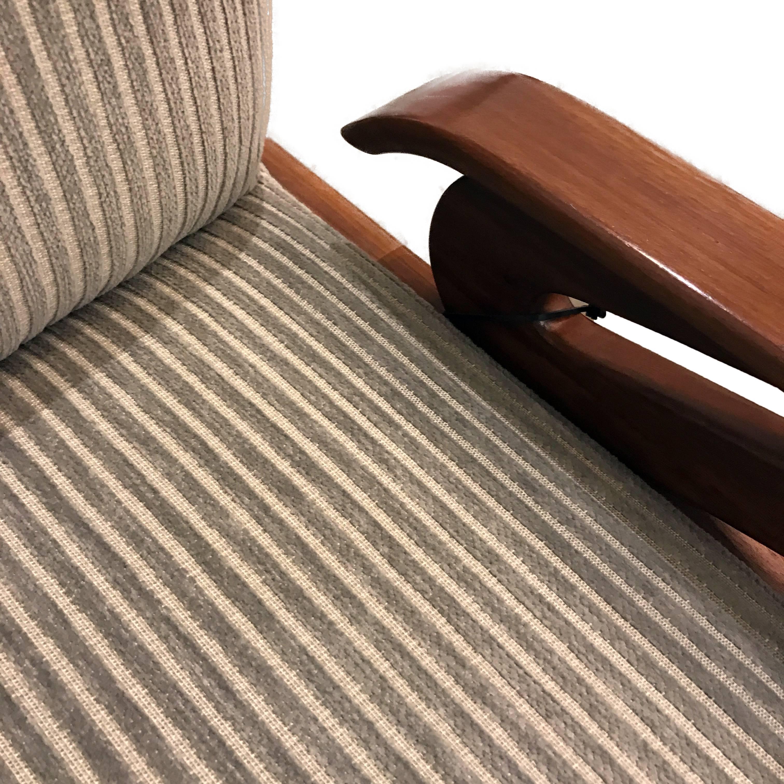 In collaboration with Alison Palevsky for Thomas Hayes Studio

Sculpturally crafted solid walnut wood frame with a tight upholstered seat and back cushion featuring brass details.