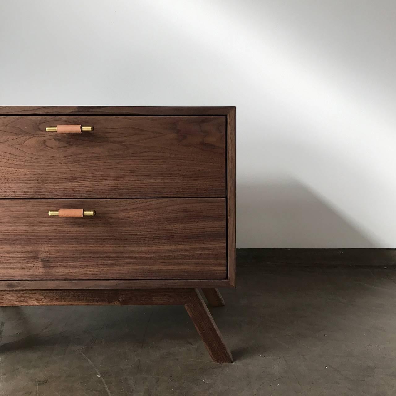 A stylish 2-drawer side table made to order by Thomas Hayes Studio. The Murphy is avaliable in a variety of wood finishes, metal finishes, and leather options. Shown in Walnut Oil, Light Patina Brass, and Natural Leather below. 

Leather Pulls: