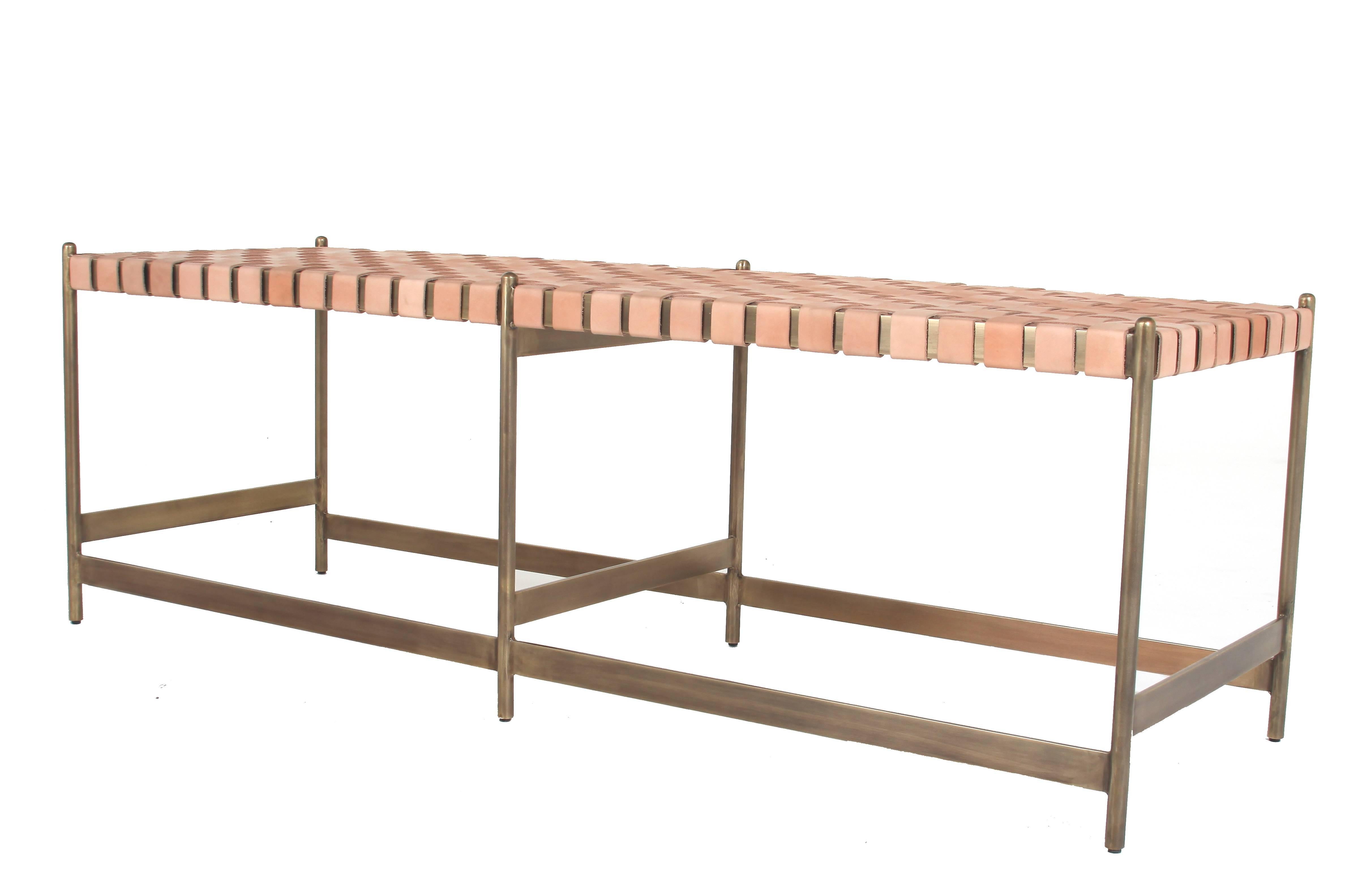 An elegant brass or steel bench available in a variety of finishes with a woven leather strap seat by Thomas Hayes Studio. It is sturdy, sleek, and versatile acting as a perfect companion to the Leather Strap Bar Stools by Thomas Hayes Studio. See