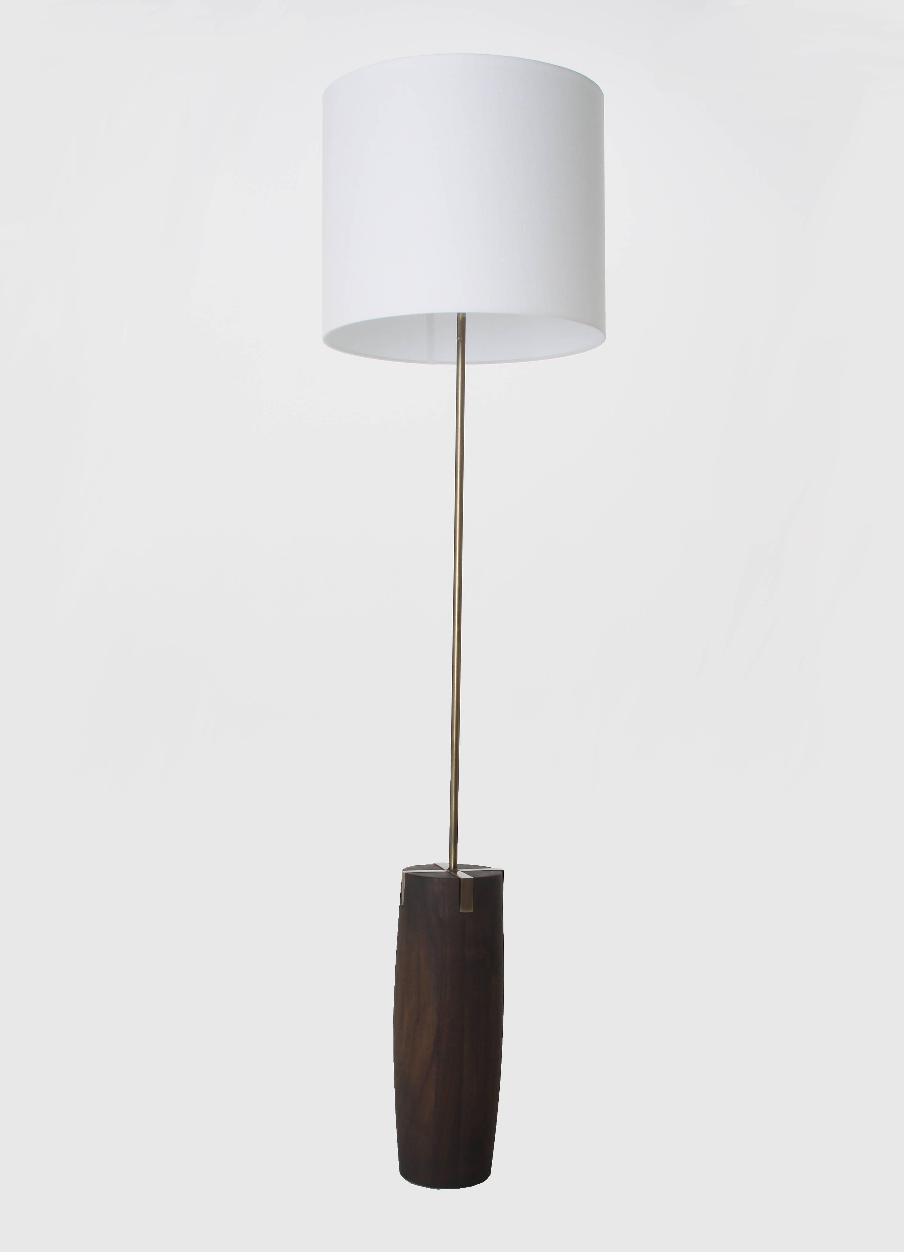 A sculptural, solid wood base lamp with X-frame inset metal detail, available in table or floor lamp sizing. Please inquire about available metal and wood finishes.

Floor lamp available at $2950
Overall dimensions: 63