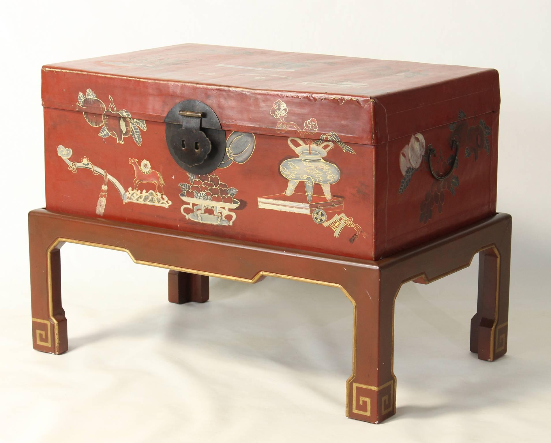 A lovely red parchment hand-painted Chinese trunk on later custom-made stand.
