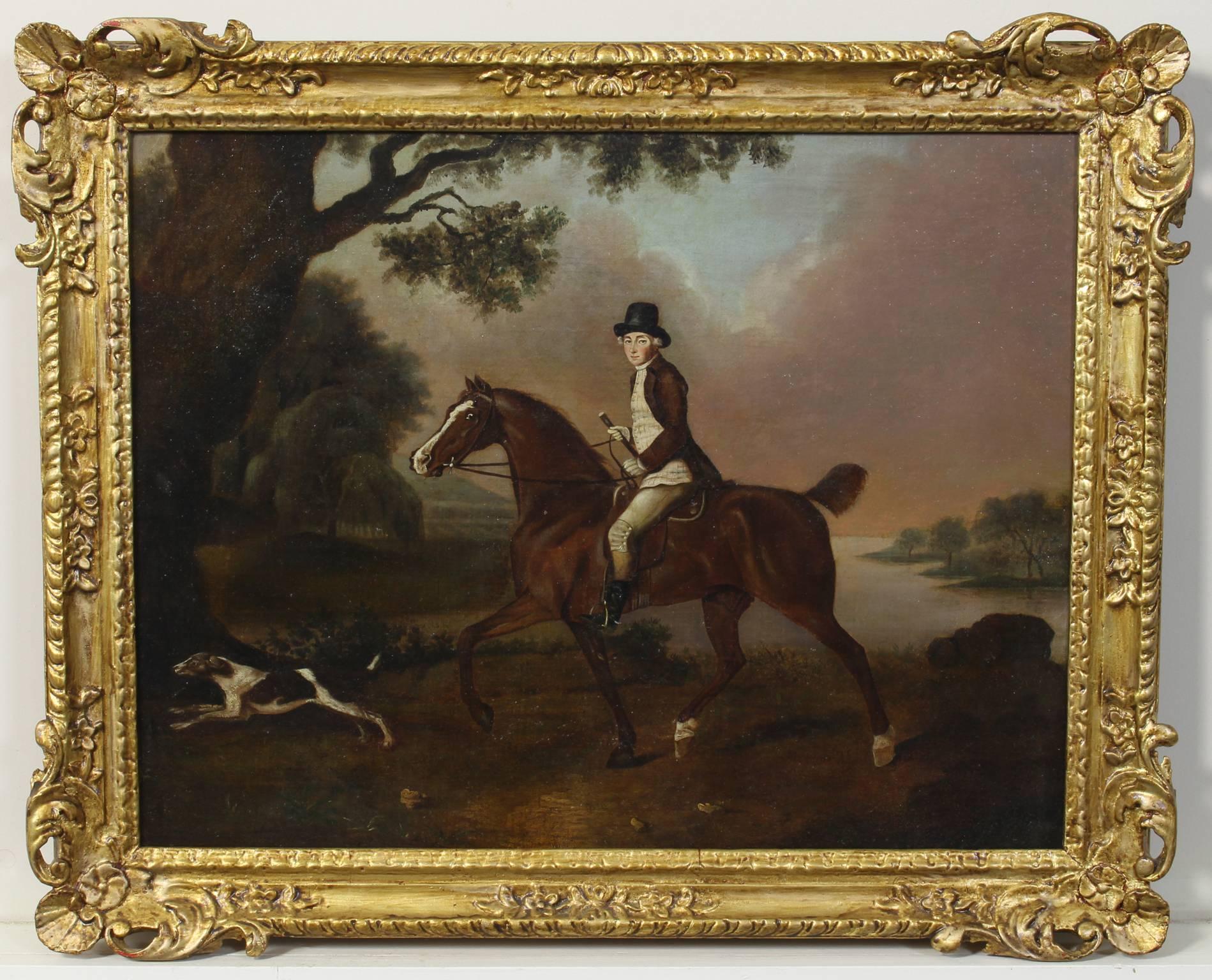 A charming late 18th century oil on canvas painting depicting a horse and rider in a landscape. The rider in brown coat, striped waistcoat and beaver hat astride a chestnut mare.