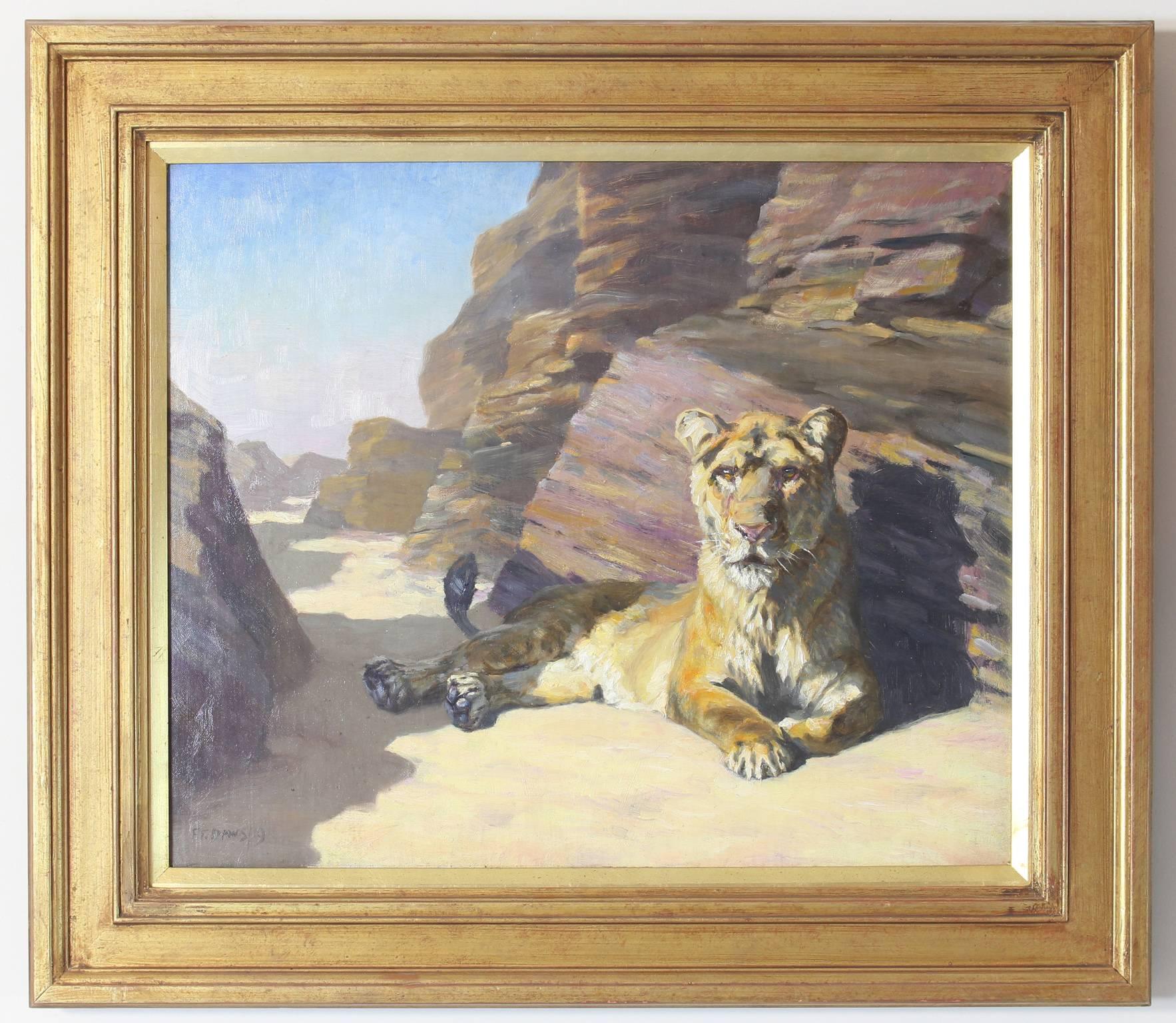 An early 20th century English oil on canvas painting of a female lion in a rocky landscape by F. T. Daws. Signed and dated lower left, set in gold wood frame.