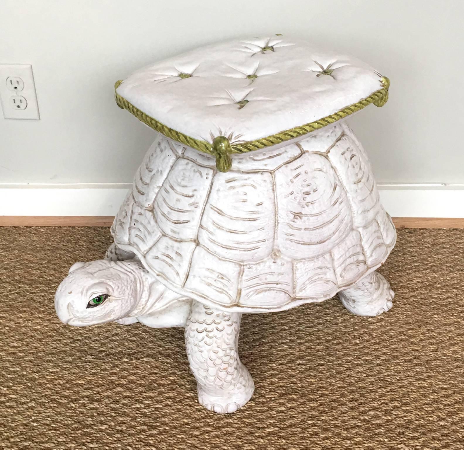 A very charming mid-20th century Italian hand-painted glazed ceramic garden seat in the form of a tortoise with a buttoned and tasseled cushion on his back.