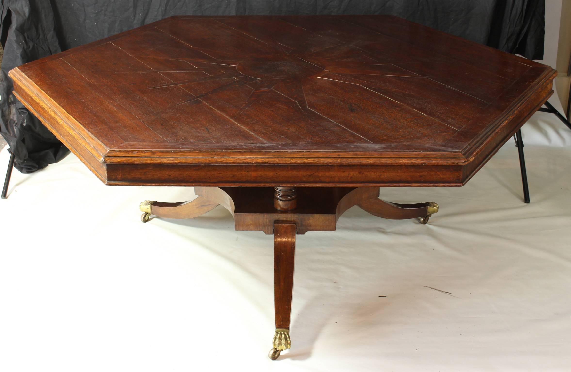 A large mid-19th century English oak hexagonal dining or center table 