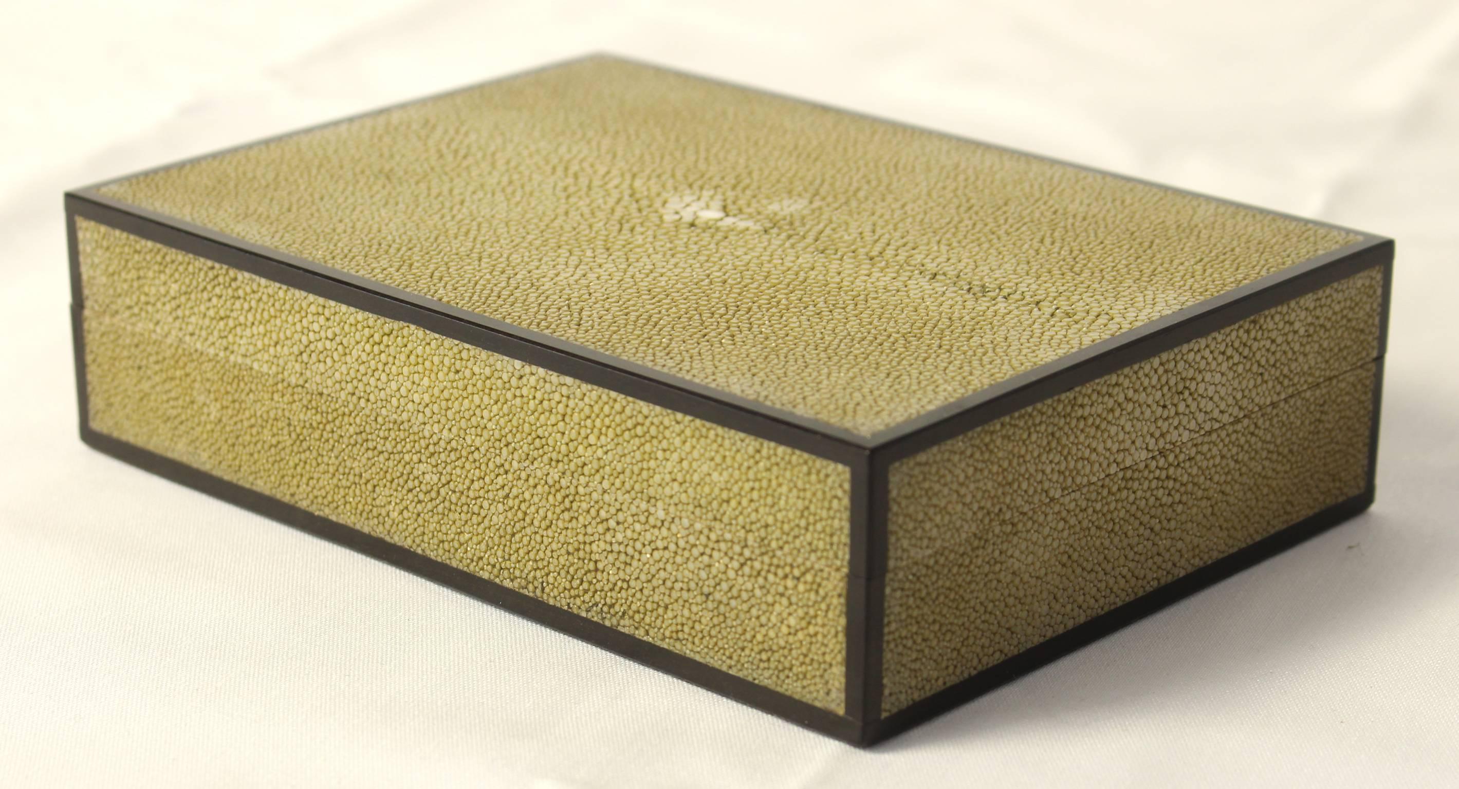 A pale green shagreen and ebony wood trimmed box lined with Spanish cedar.
