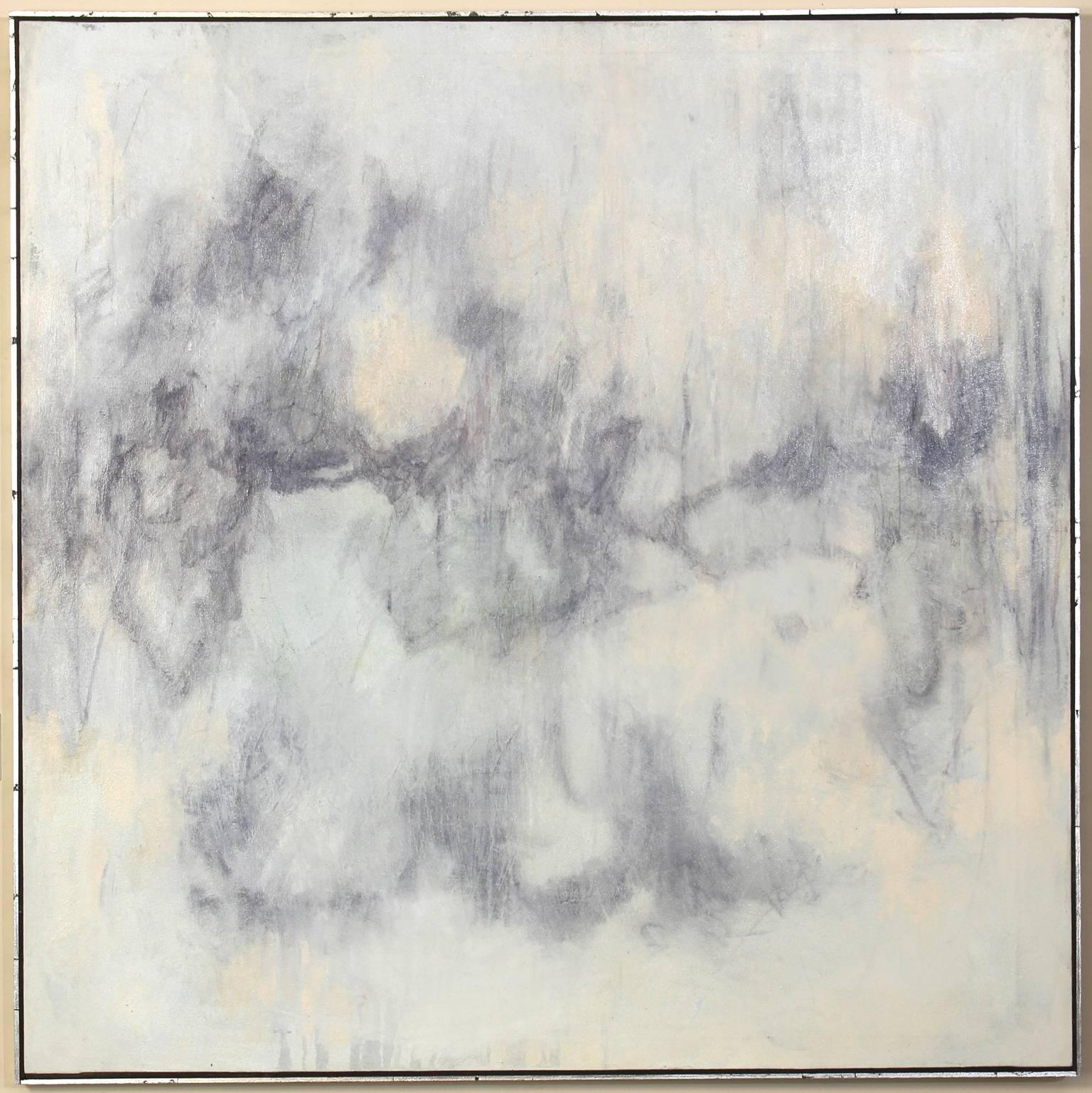 A large contemporary abstract painting in soft blues melding into dark greys on a soft pastel colored field.