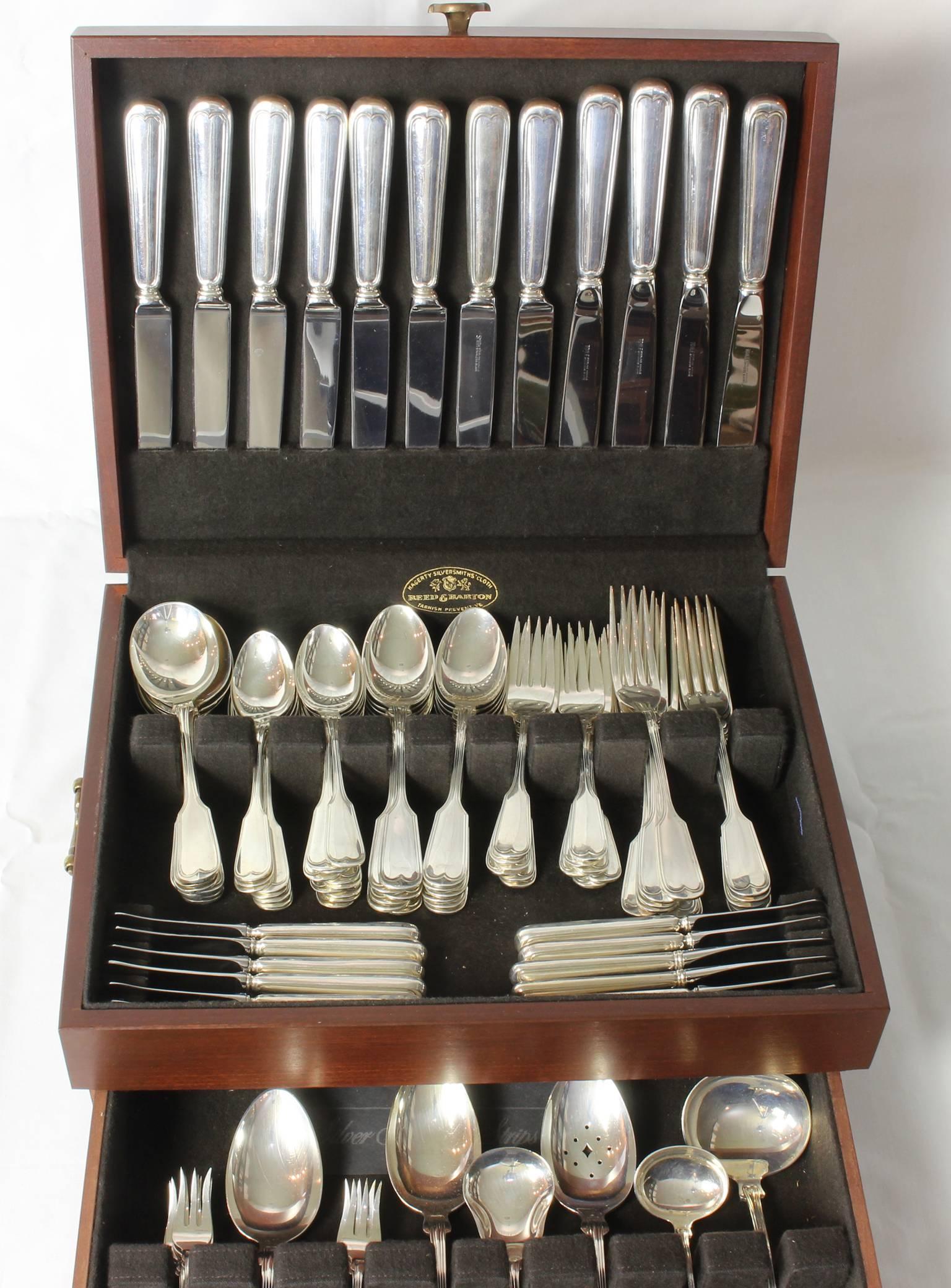 A large set of mid-20th century sterling flatware, service for 12, by Massachusetts
silversmith Frank Smith, in the fiddle and thread pattern. It is comprised of
12 dinner forks, salad forks, knives, pudding spoons, tea spoons and butter knives,