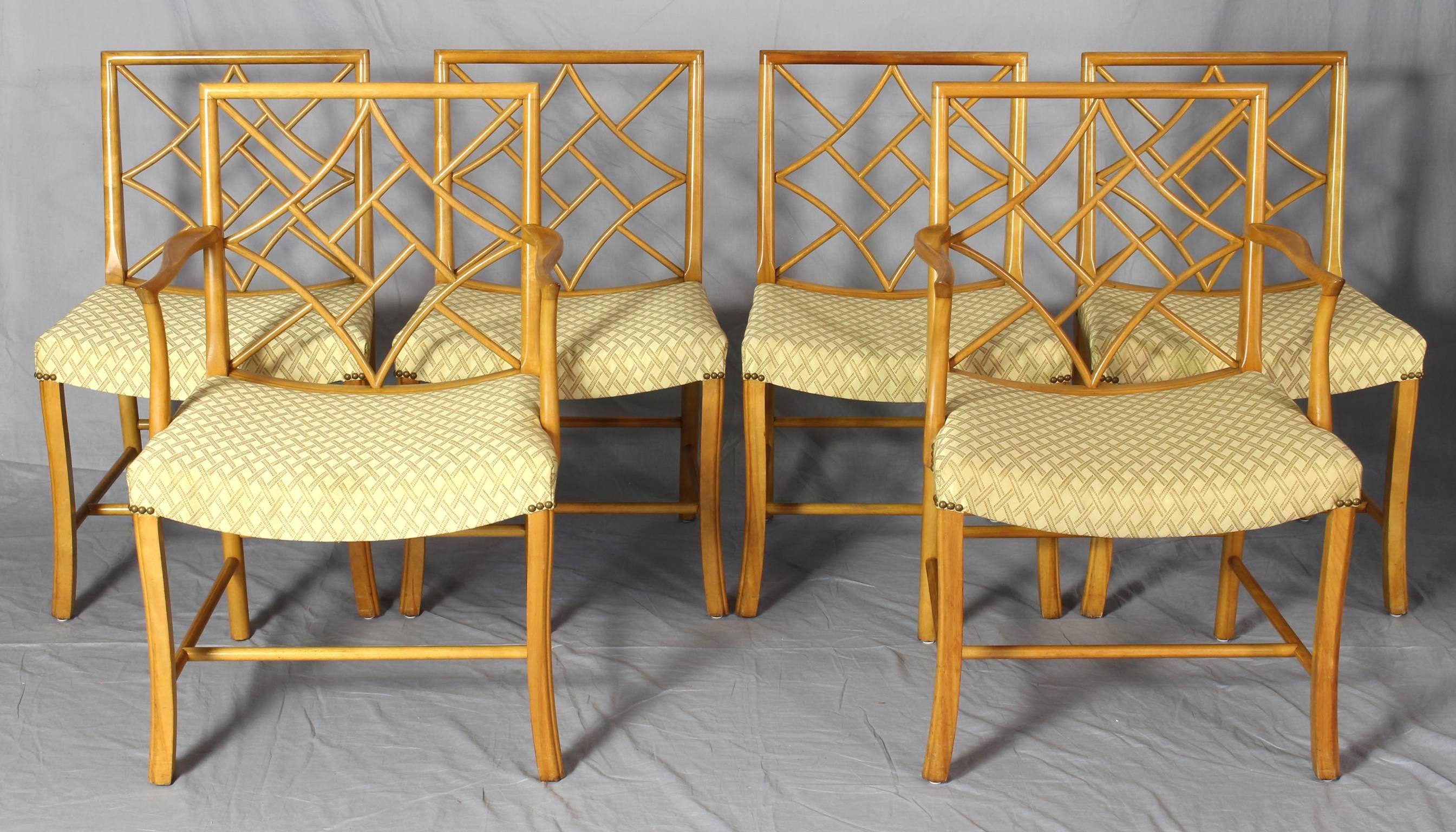 An elegant set of six Chinese Chippendale cockpen dining chairs dating from the 1930s in light golden maple comprising four sides and two arms.