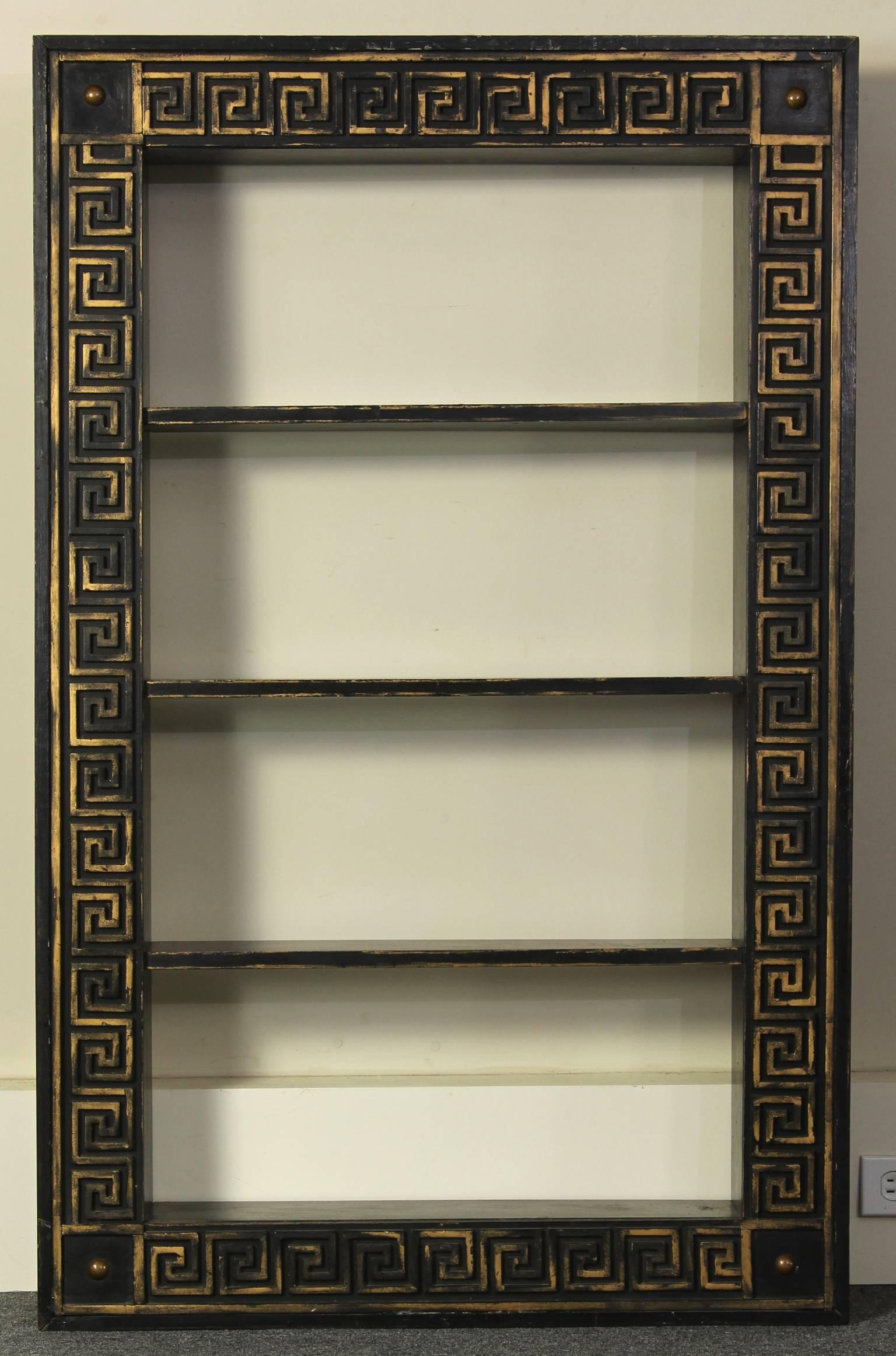 A charming custom-made Federal style bookcase painted and gilded with carved Greek key design.