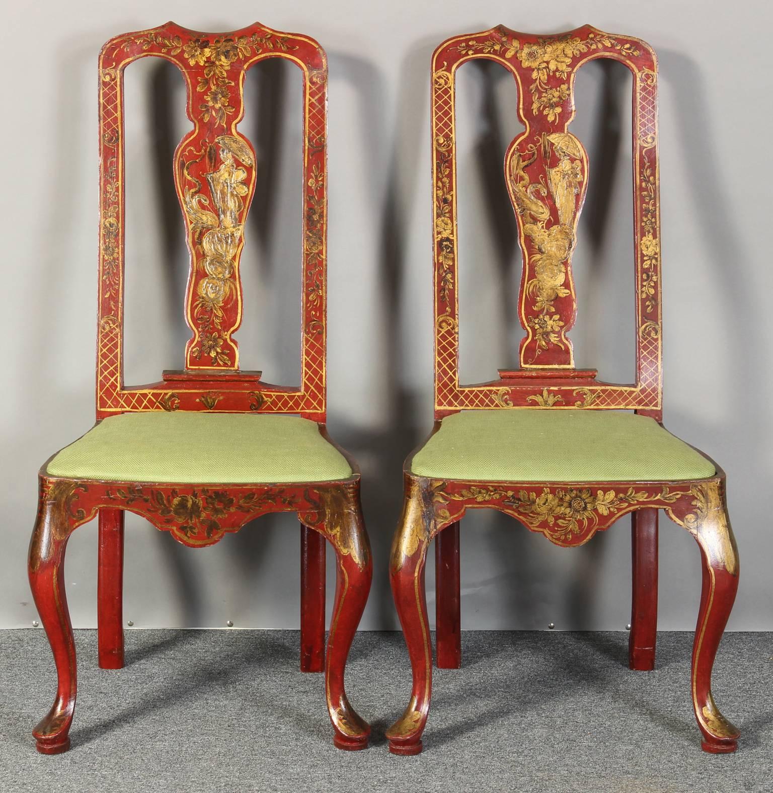 A pair of Italian scarlet colored mid-20th century Queen Anne style chinoiserie side chairs in with Fine gilt decoration and green linen seat cushion.