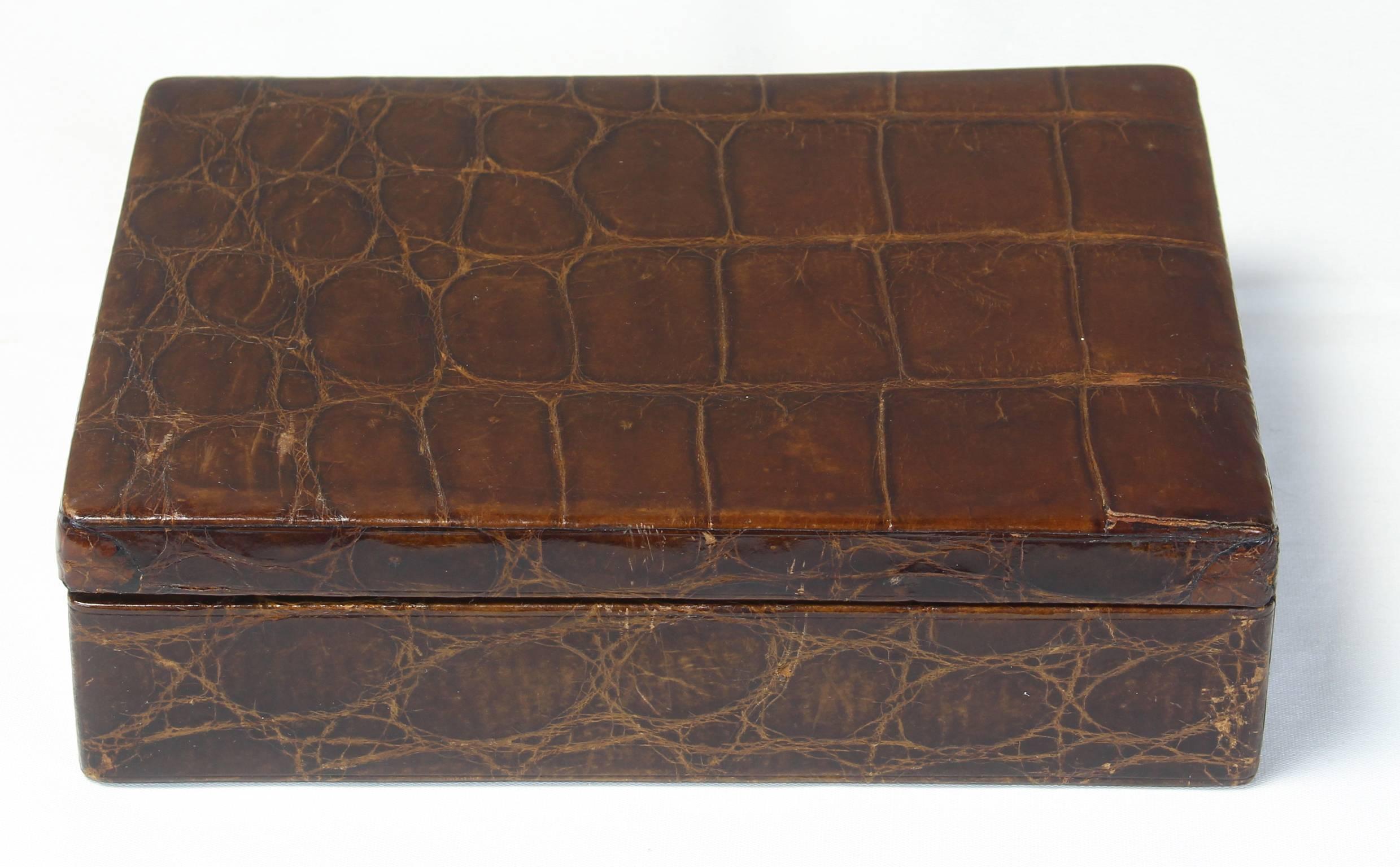 A large and elegant alligator covered box dating from the 1920s, perfect for a gentleman's dresser to receive cufflinks, watches and spare change.