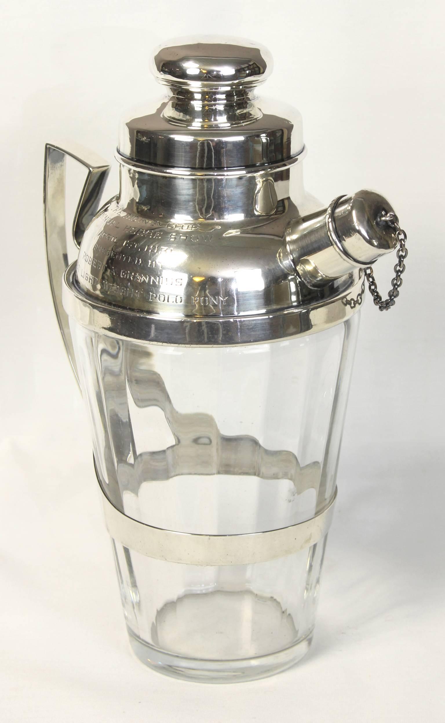 A beautifully engraved sterling silver and crystal cocktail Shaker dating from the early 1930s. The Shaker was presented as a trophy for the winner of an equestrian competition.