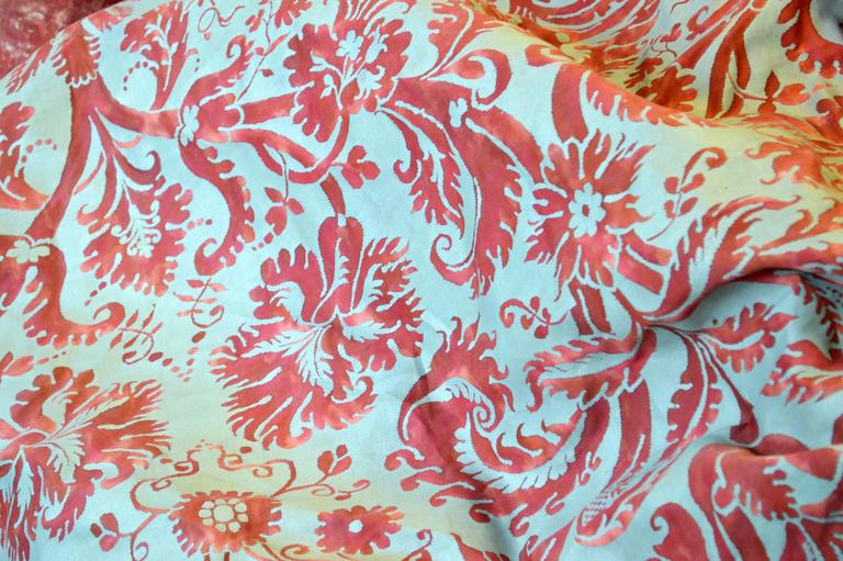 A 28 yard unused bolt of vintage Fortuny fabric in the Demedici pattern. Hand printed cotton in red with a silver-blue overlay. The bolt measure 50