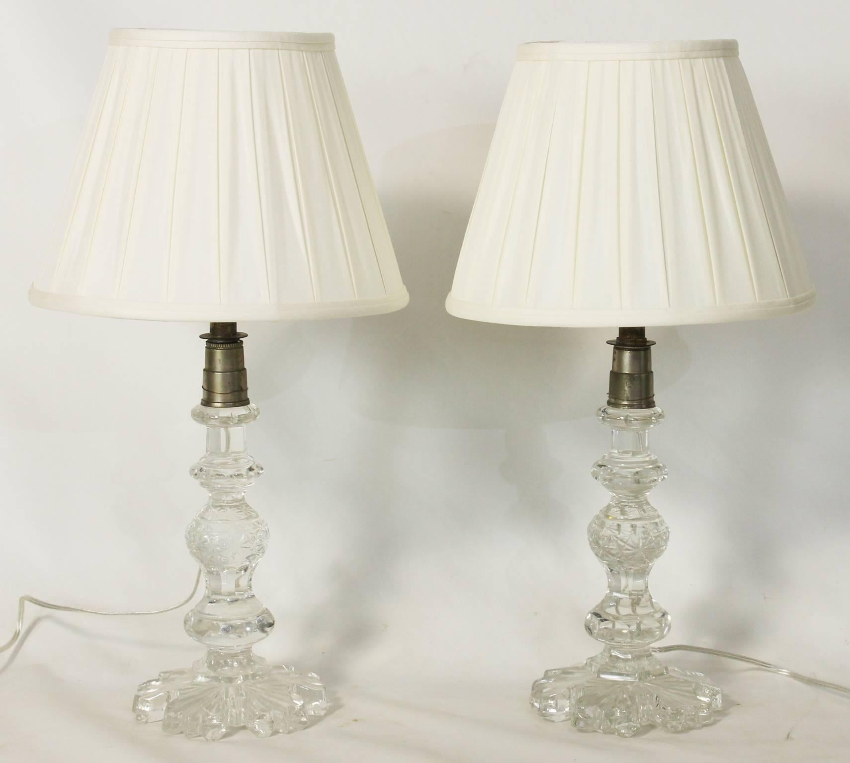 A large and lovely pair of mid-19th century Anglo Irish candlestick table lamps with silk pleated shades. The lamps have been newly professionally wired.