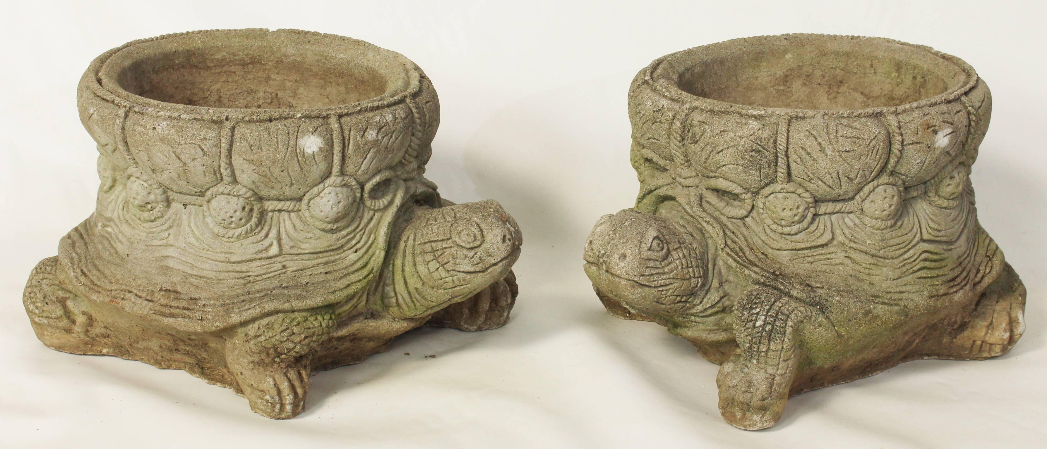 A charming pair of cast stone garden planters in the form of turtles dating from the 1960s.