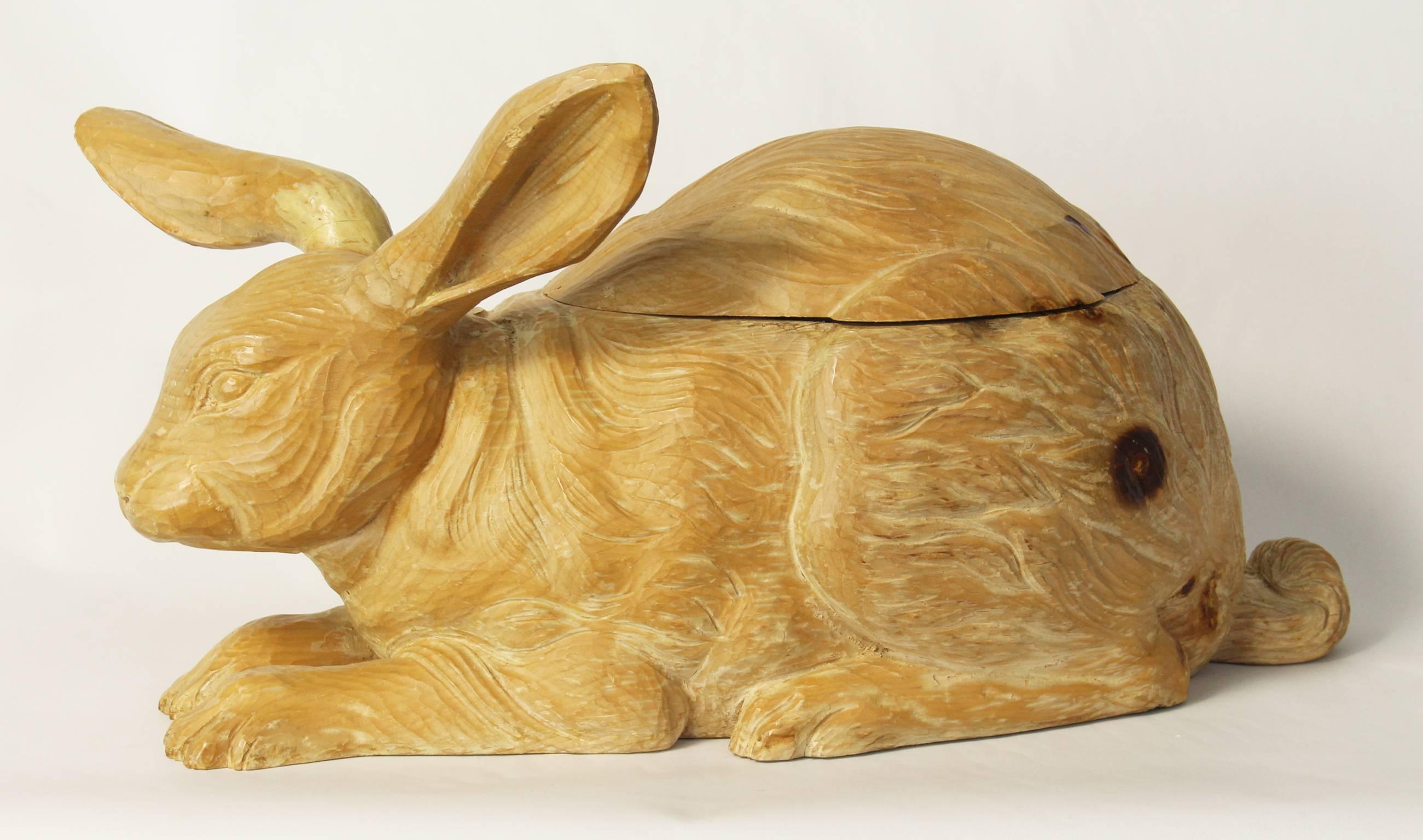 An Italian carved wood ice bucket in the form of a resting rabbit dating from the 1950s.