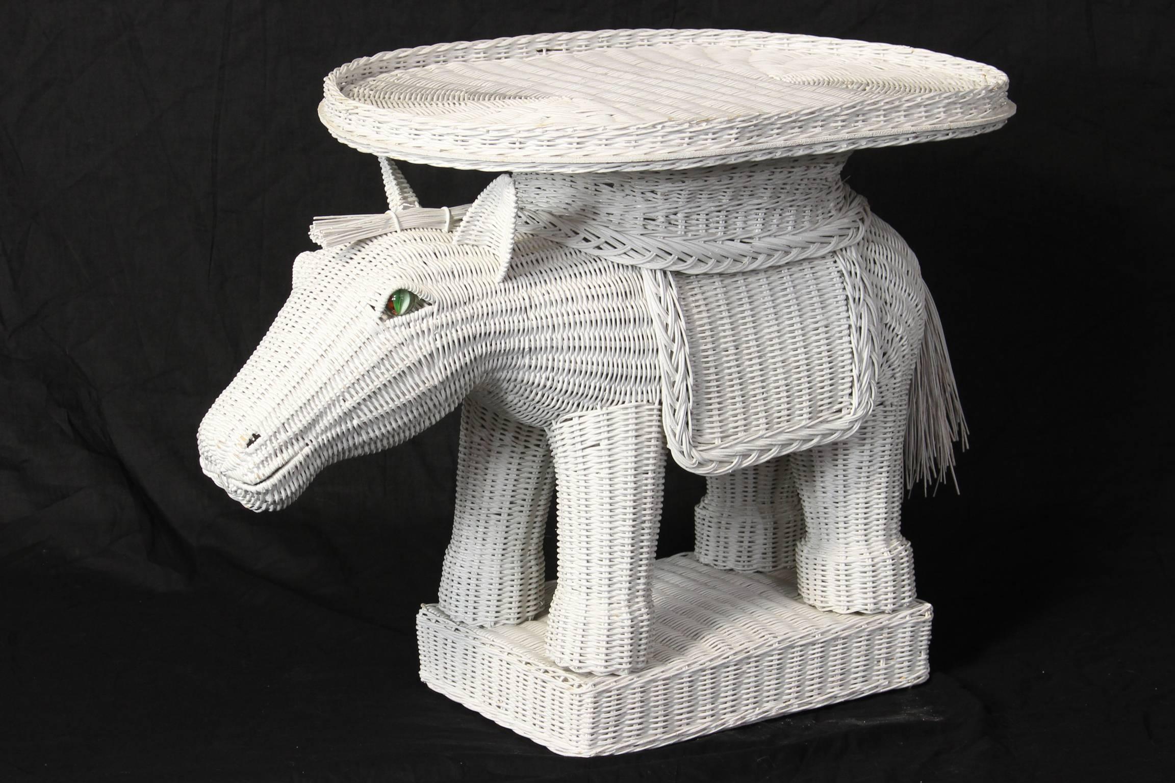 A charming woven wicker side table in the form of a donkey with removable tray and glass eyes.
 