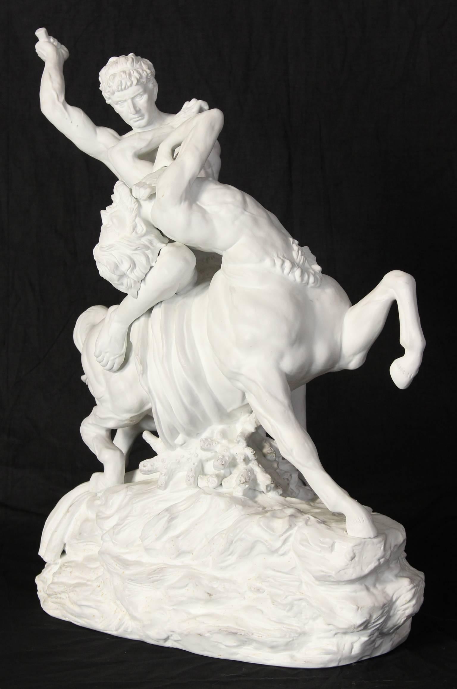 A massive Dresden porcelain sculpture of a centaur and man in battle.
    