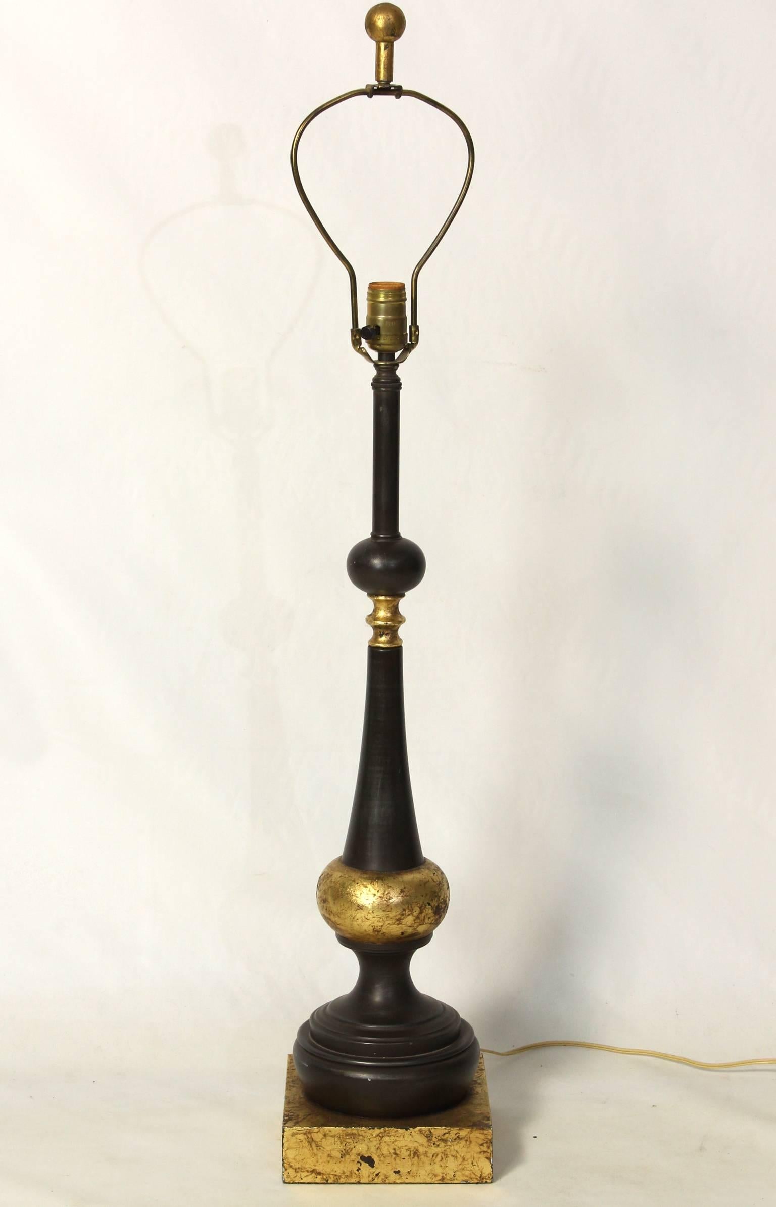 A large gun metal steel and gilt decorated balustrade form table lamp dating from the 1950s.