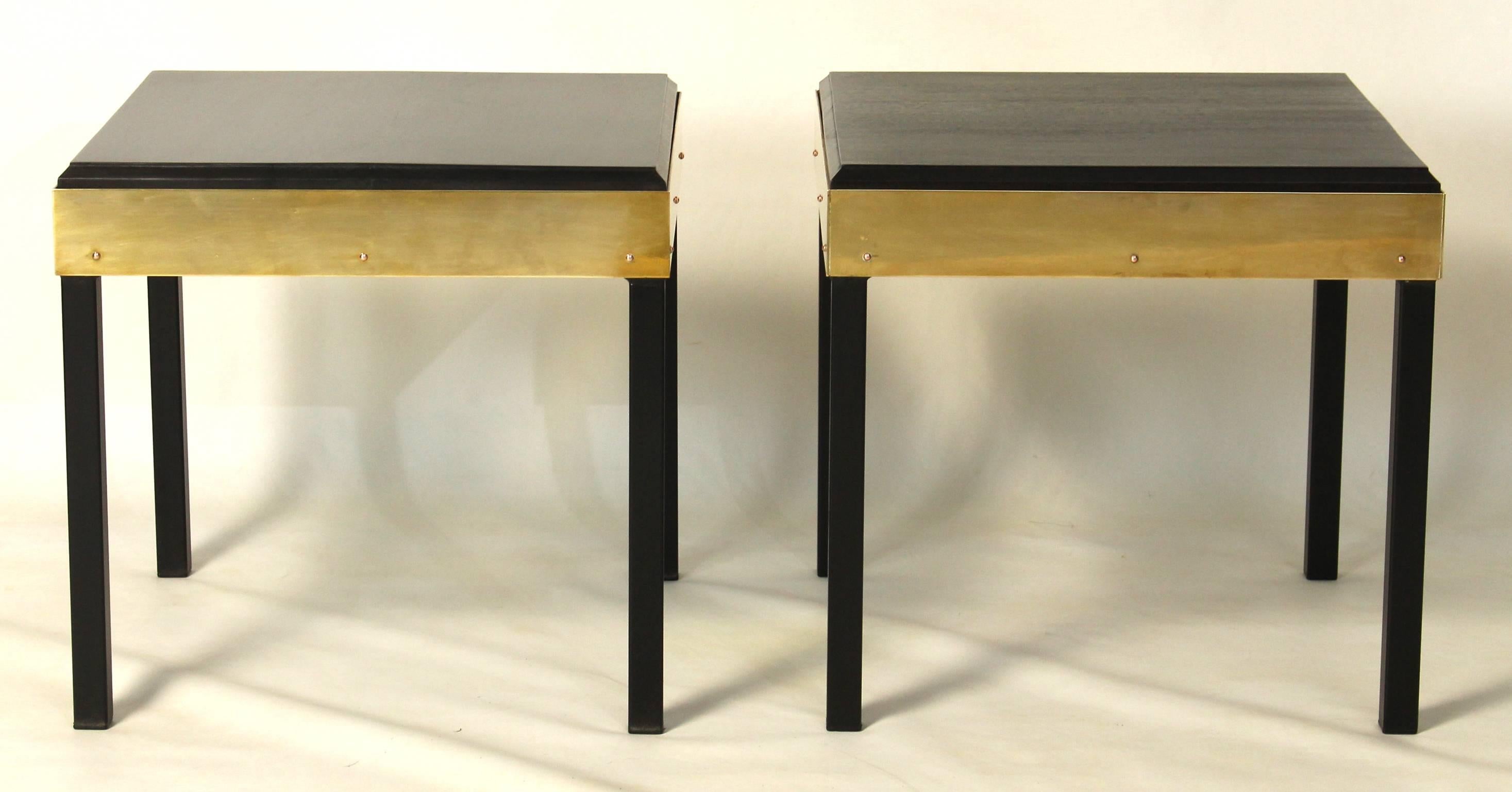 A pair of mid 20th century brass, steel and ebonized mahogany occasional or side tables.