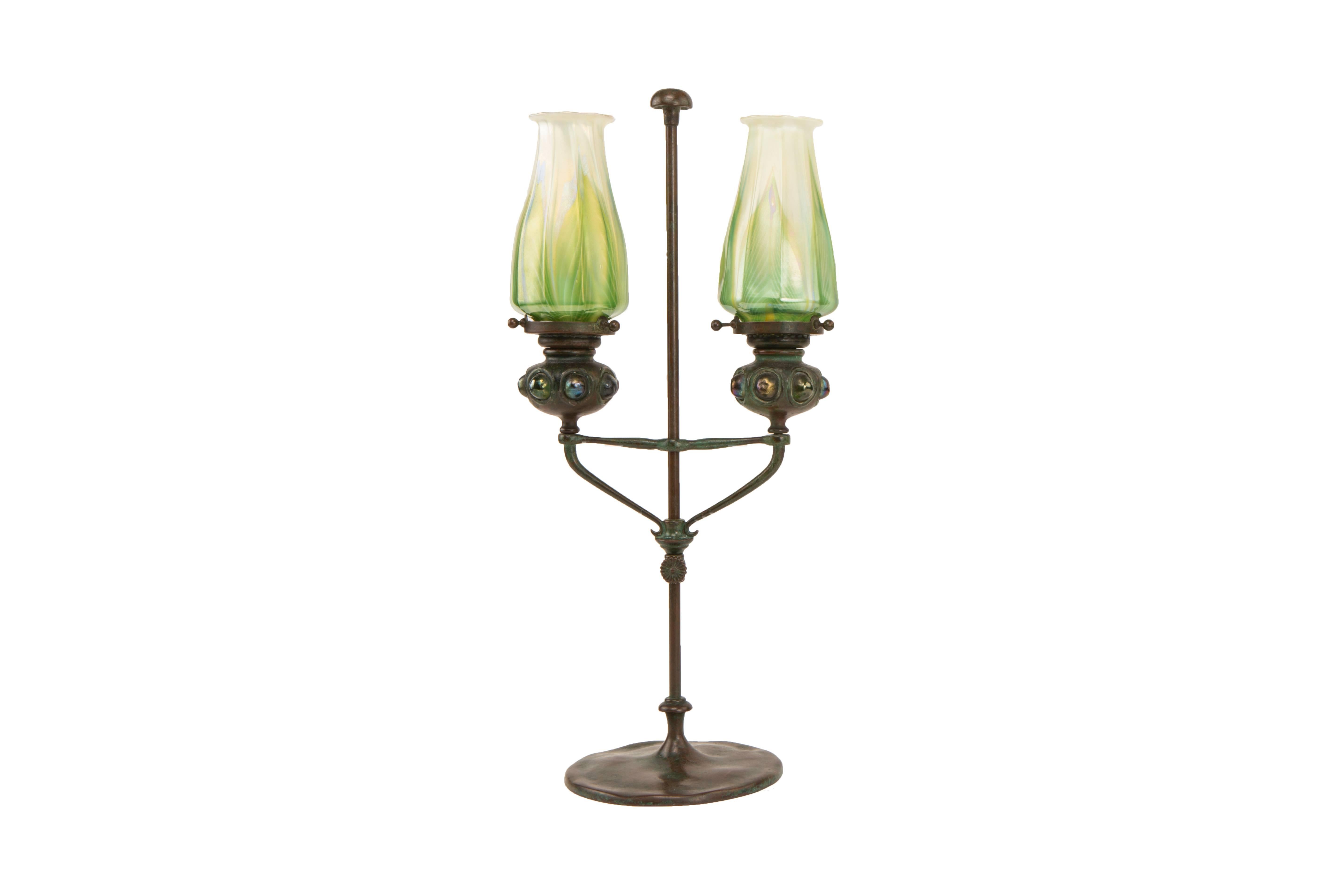 An American Art Nouveau patinated bronze and favrile glass 