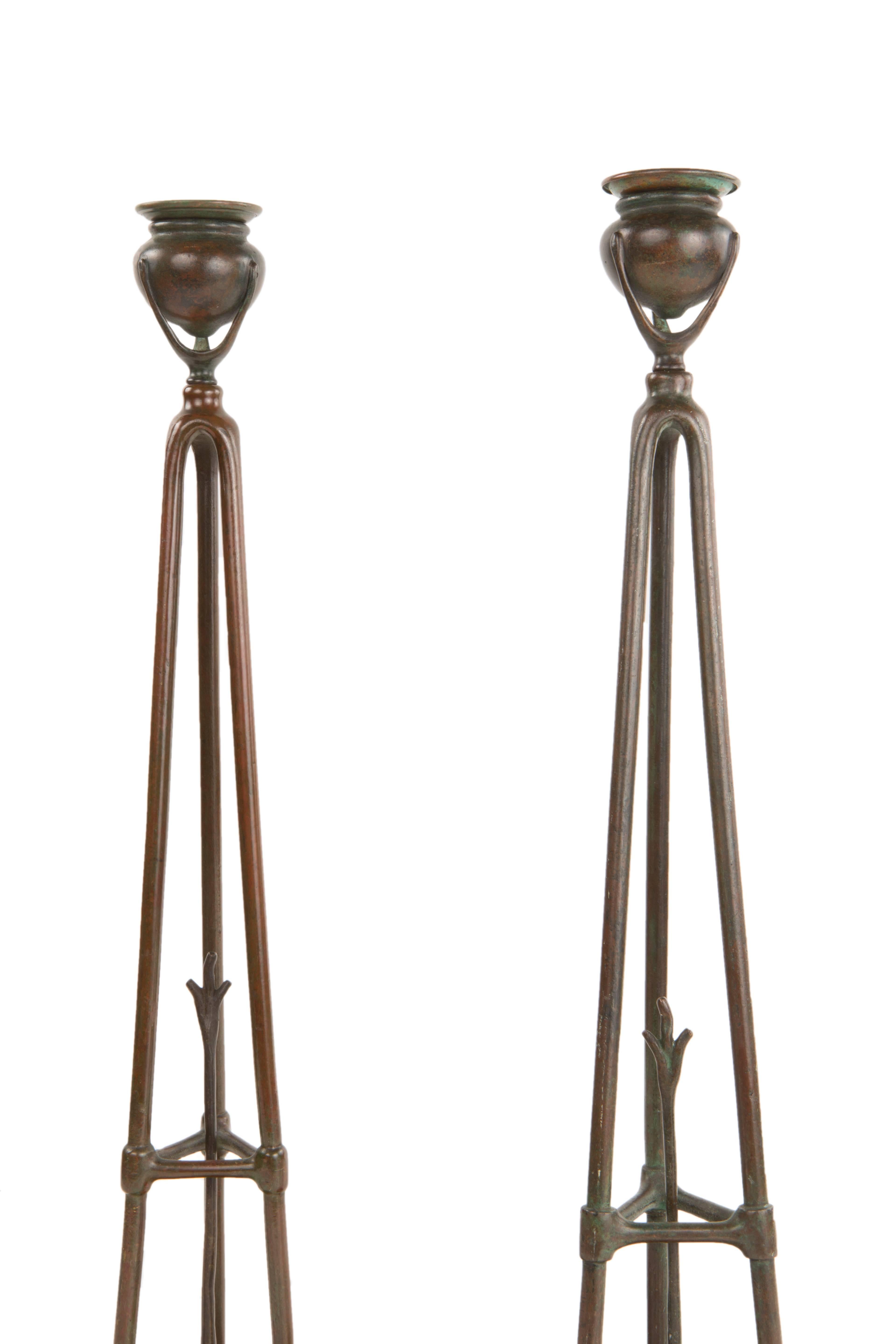 A pair of Art Nouveau patinated bronze 