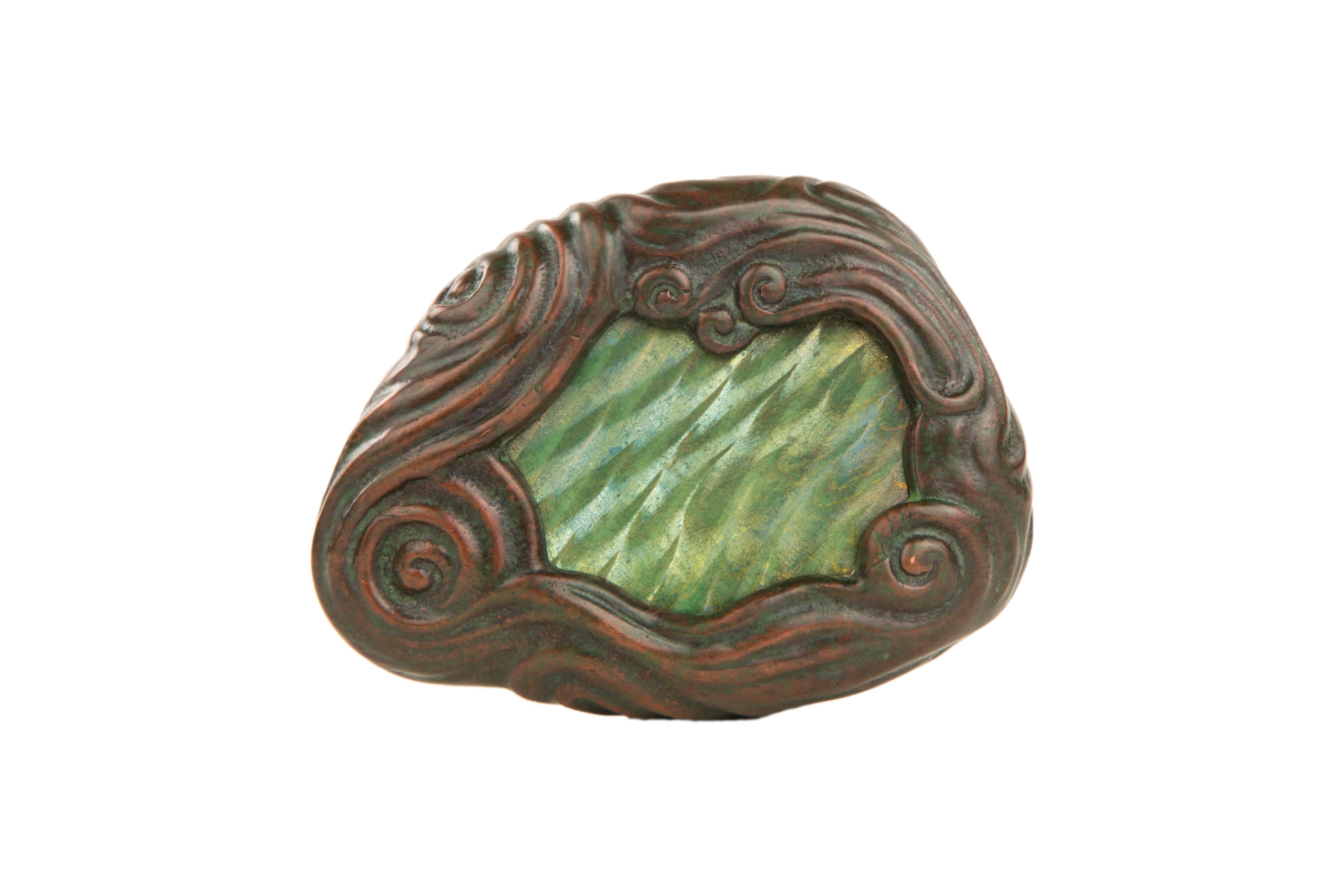 An American Art Nouveau patinated bronze and glass 
