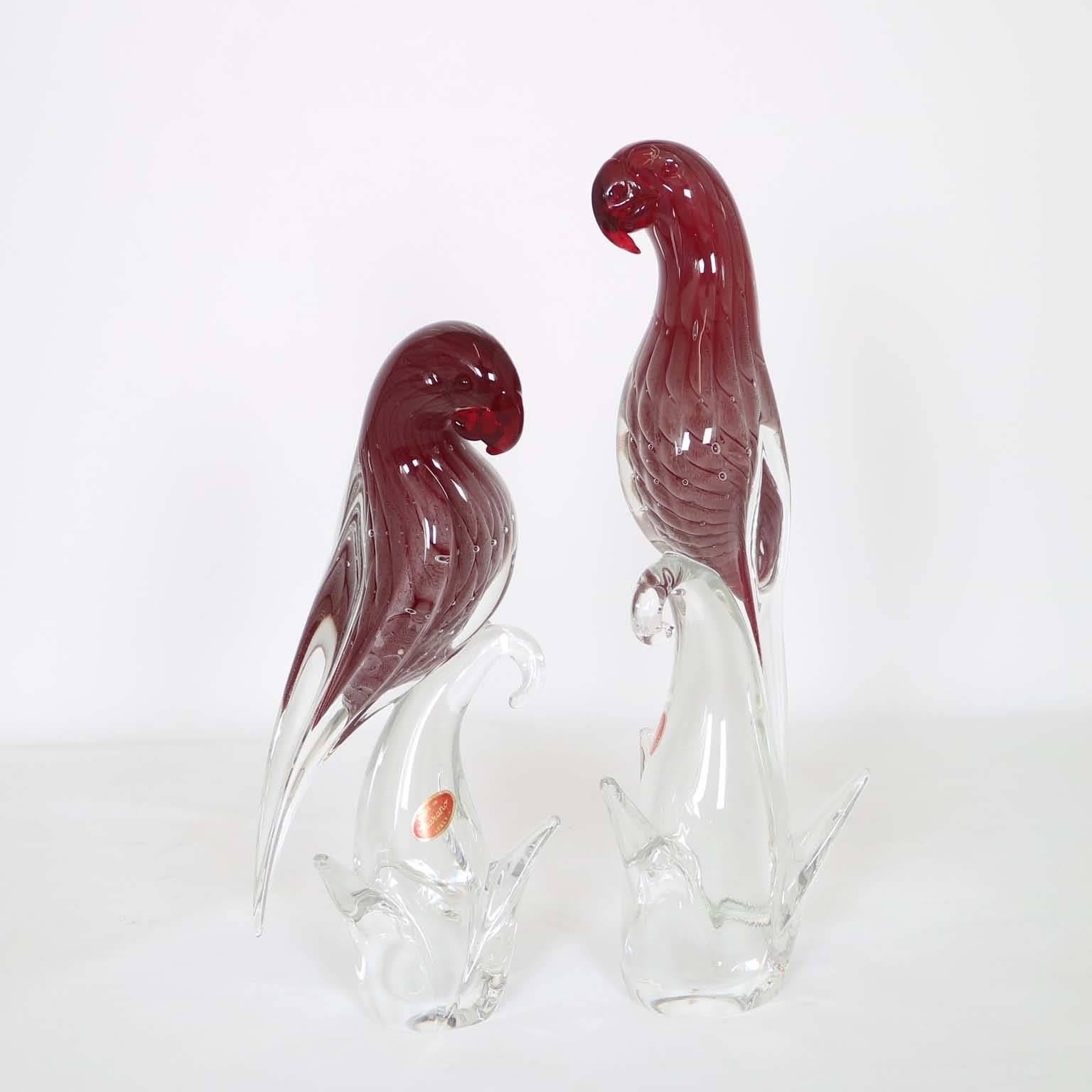 A beautiful pair of Murano glass parrot birds by Barbini, produced in Italy, circa 1950s, each in deep amethyst color with clear Sommerso layers. Markings include original labels. Excellent vintage condition.

Individual dimensions:
Tall: 14” H x