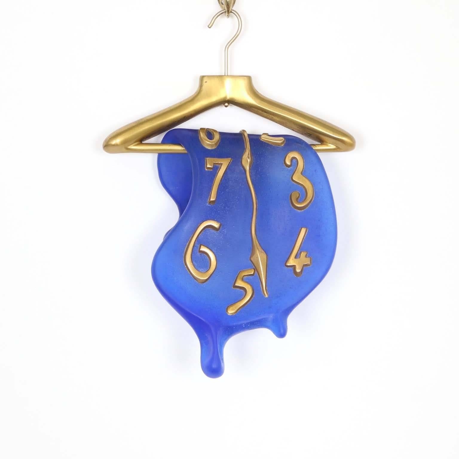 A limited edition wall sculpture designed by Salvador Dali (1904-1989) and produced by Daum, as part of the collaboration between the artist and the French art glass company, lasting from 1968 until 1984. Recreating Dali’s melting clock in blue