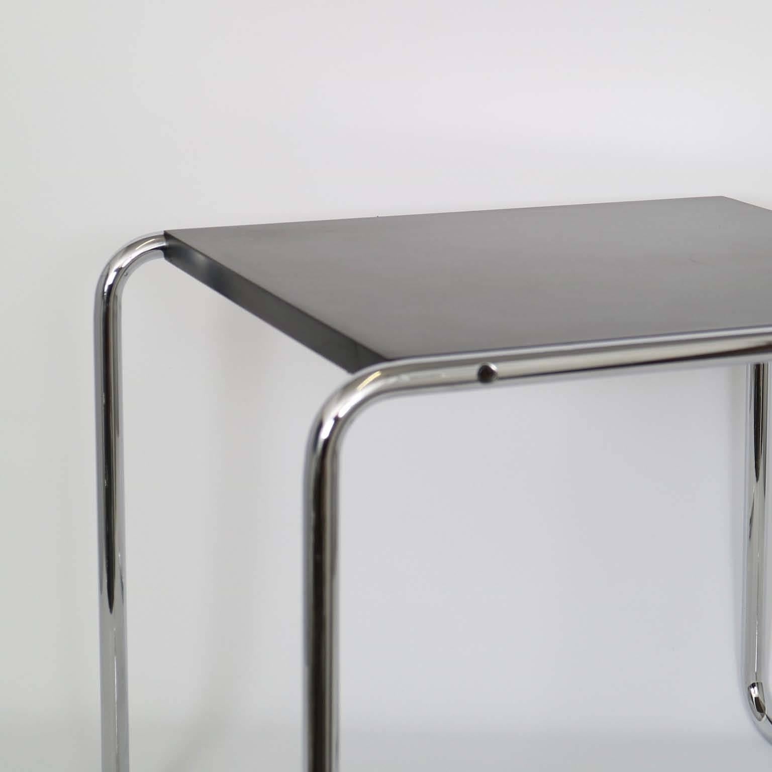 Designed by Marcel Breuer in 1925 to accompany the Wassily chair, this side table or stool of tubular steel was manufactured by Knoll in the 1970s, with black Formica top, the underside in black matte, all original. Markings include [KNOLL STUDIO