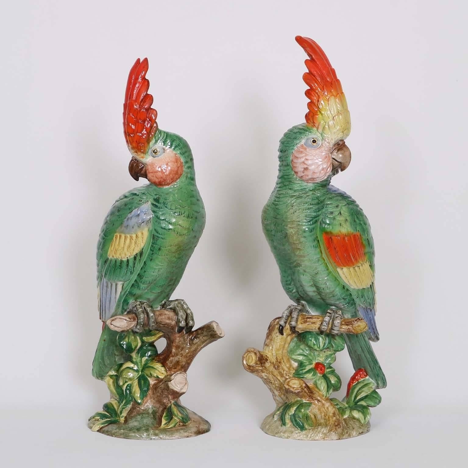 A spectacular pair of Mid-Century Italian Majolica parrots, produced circa 1950s, with a beautiful combination of colors, artist signed. Excellent vintage condition, wear consistent with age and use.