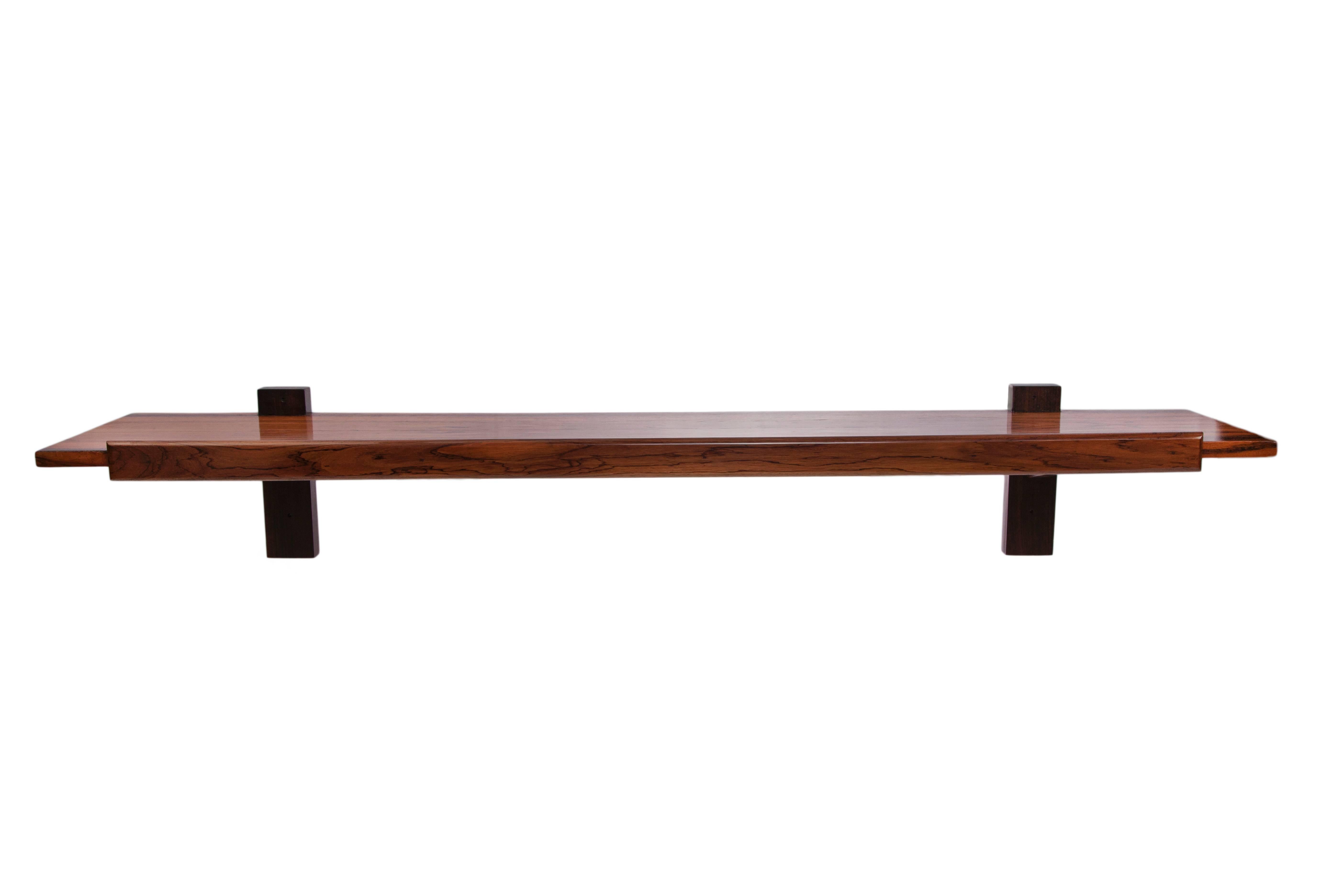 A wall-mount console by designer Sergio Rodrigues, produced circa 1960s, of linear form, crafted of rich Brazilian jacaranda. Very good vintage condition.

10906