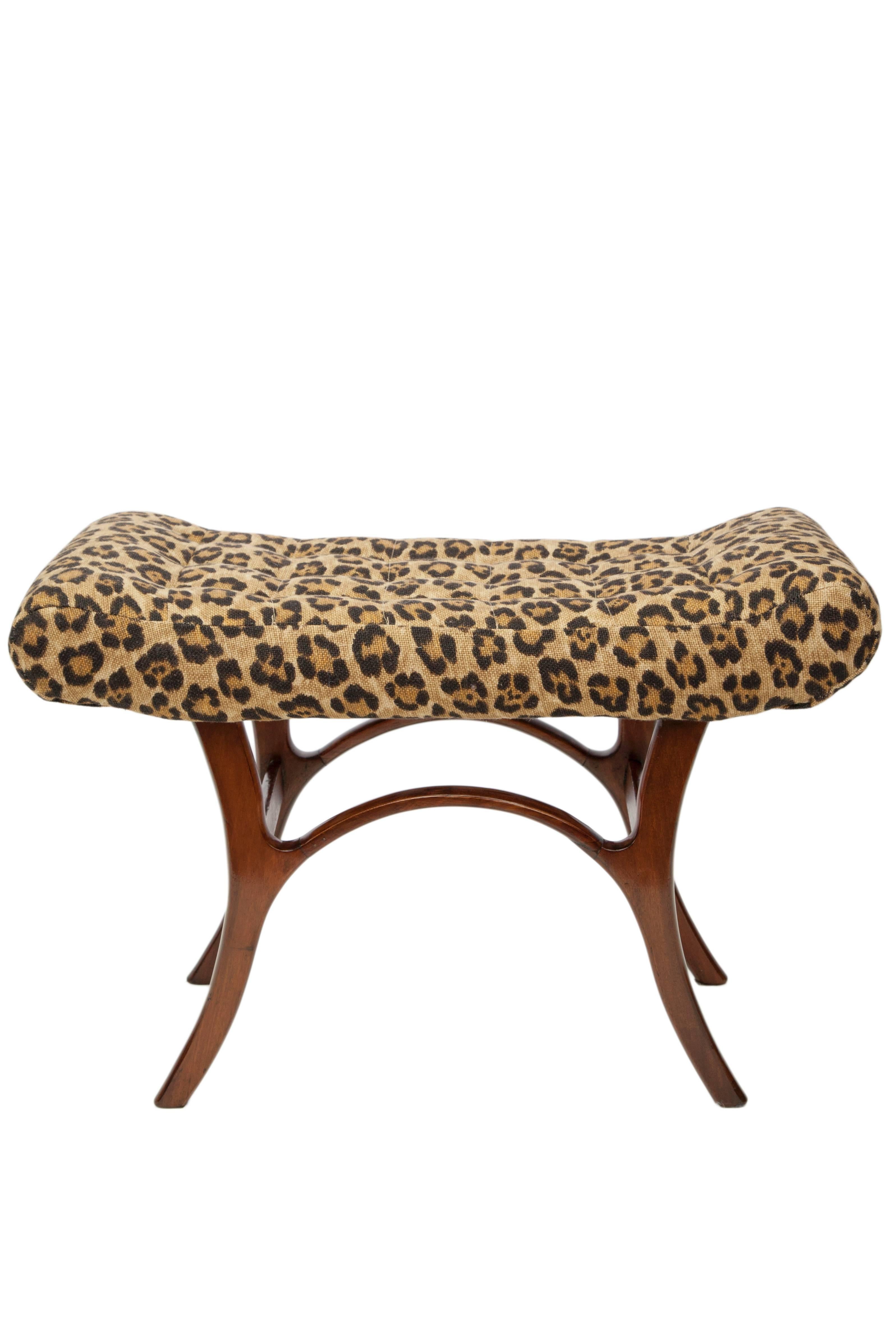 A 1950s Brazilian modern bench, designed by Giuseppe Scapinelli, seat upholstered in leopard print linen, raised on wood base with curved saber legs. Very good vintage condition.

10907
