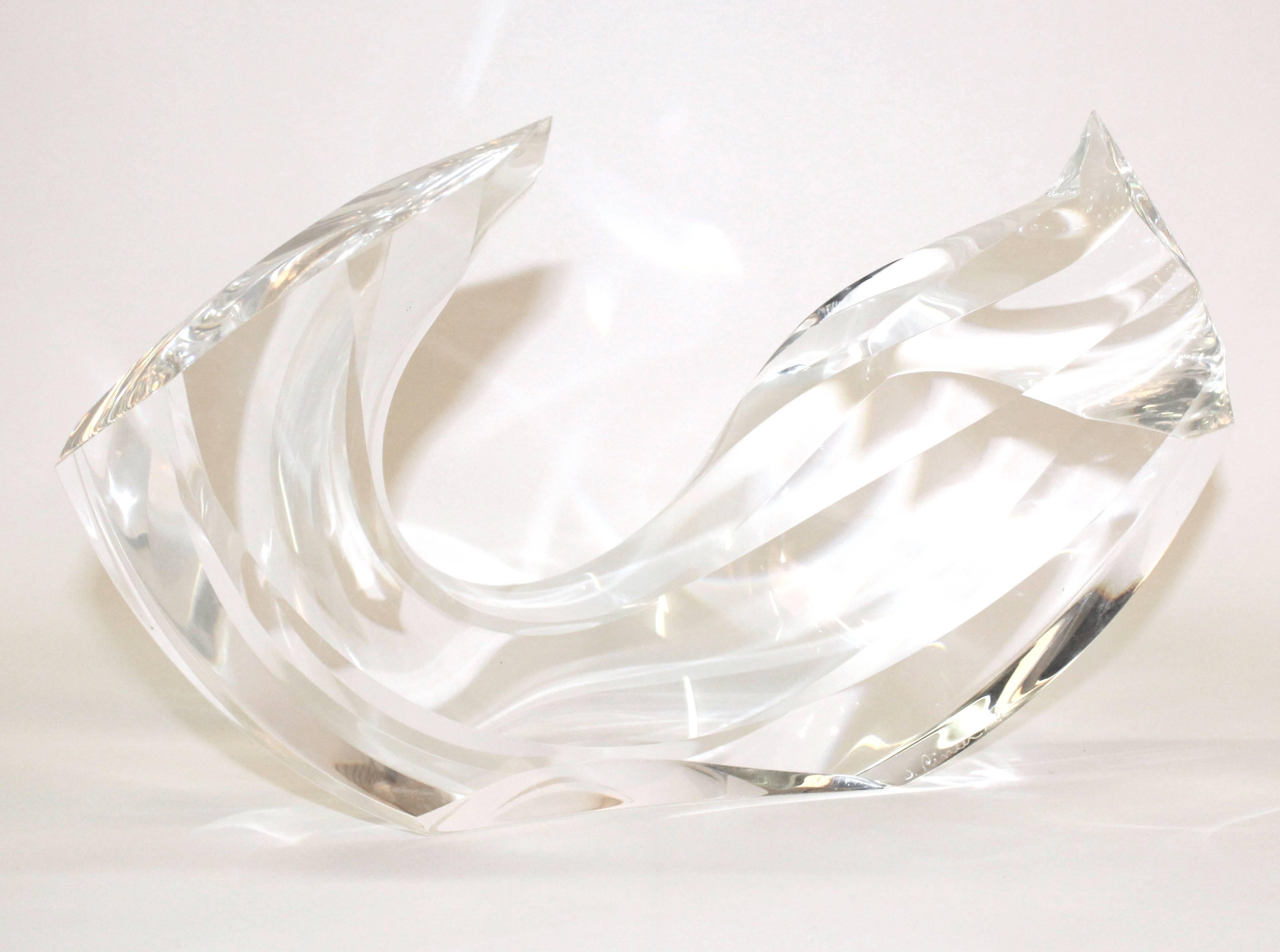 A signed abstract modern arch form sculpture, produced circa 1970s, in clear Lucite. Markings include the artist's signature [J. Rineer] numbered [A16] to the base. Excellent vintage condition, consistent with age and use.

110069