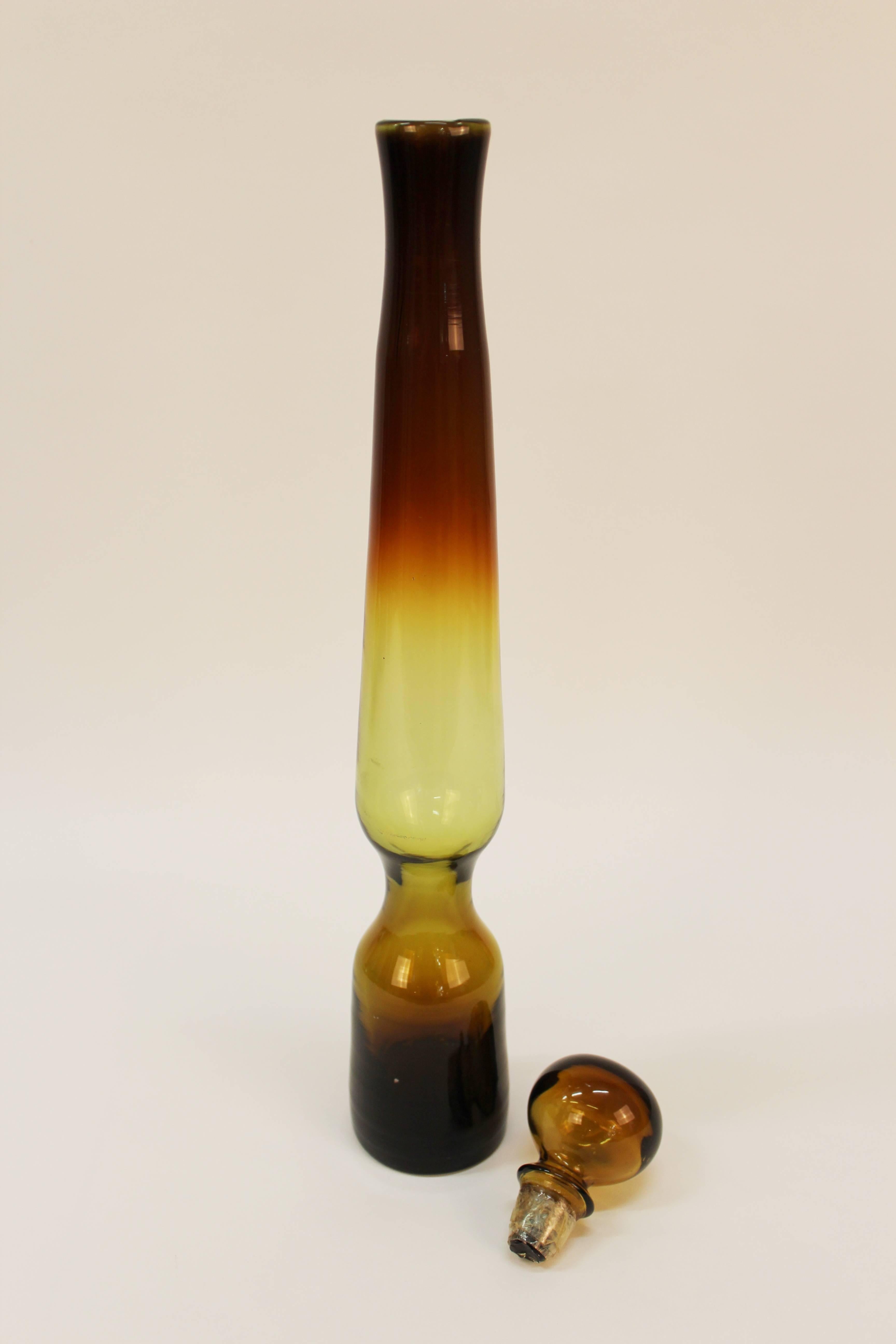 A set of six mouth blown glass decanters designed by Tom Connally for Greenwich Flint-Craft, produced circa 1969-1972, in varying forms and tones of burnt honey. Excellent vintage condition, wear consistent with age; May be sold