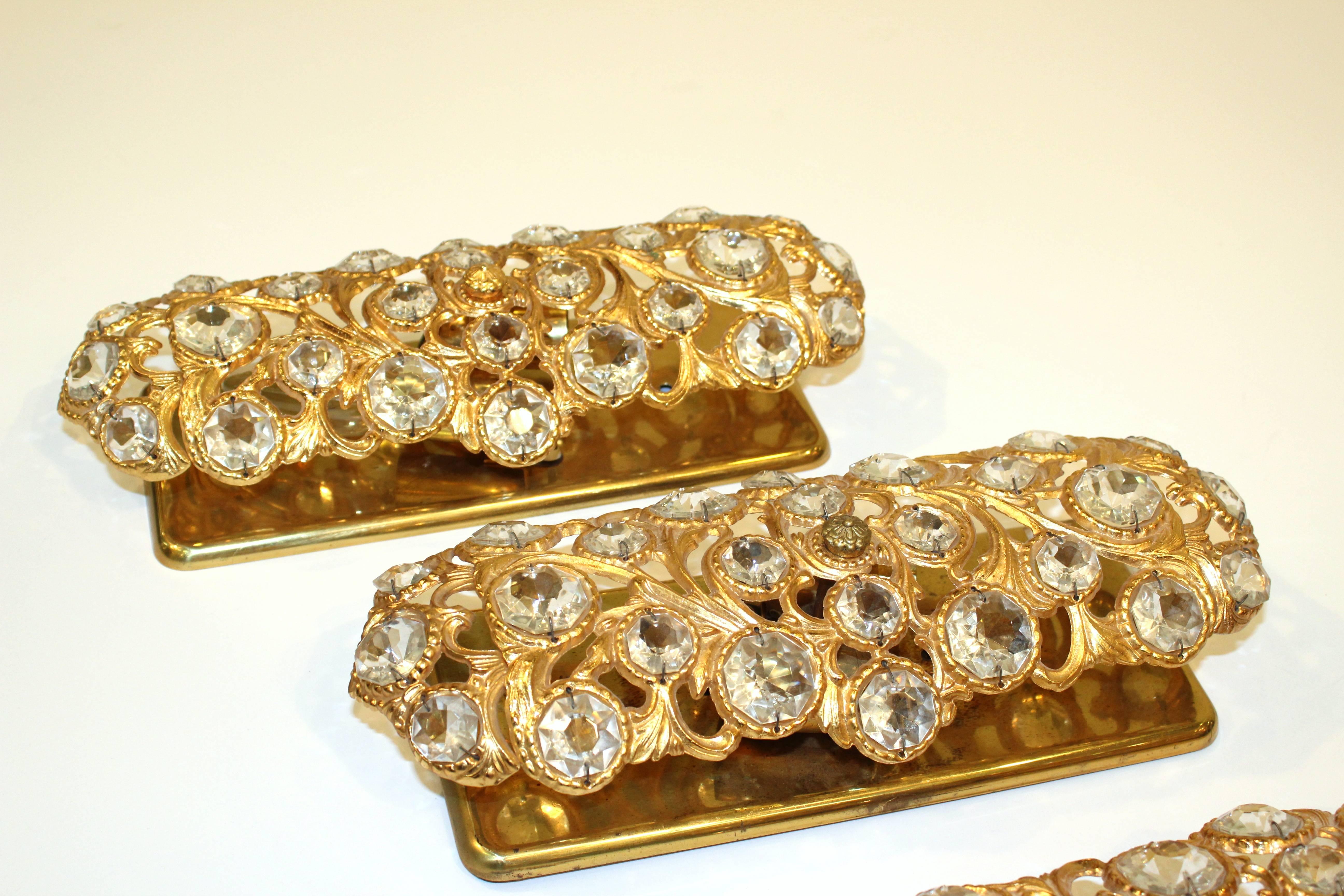 Hollywood Regency Set of Four Gold Toned Metal Sconces with Sunken Glass Prisms, Signed