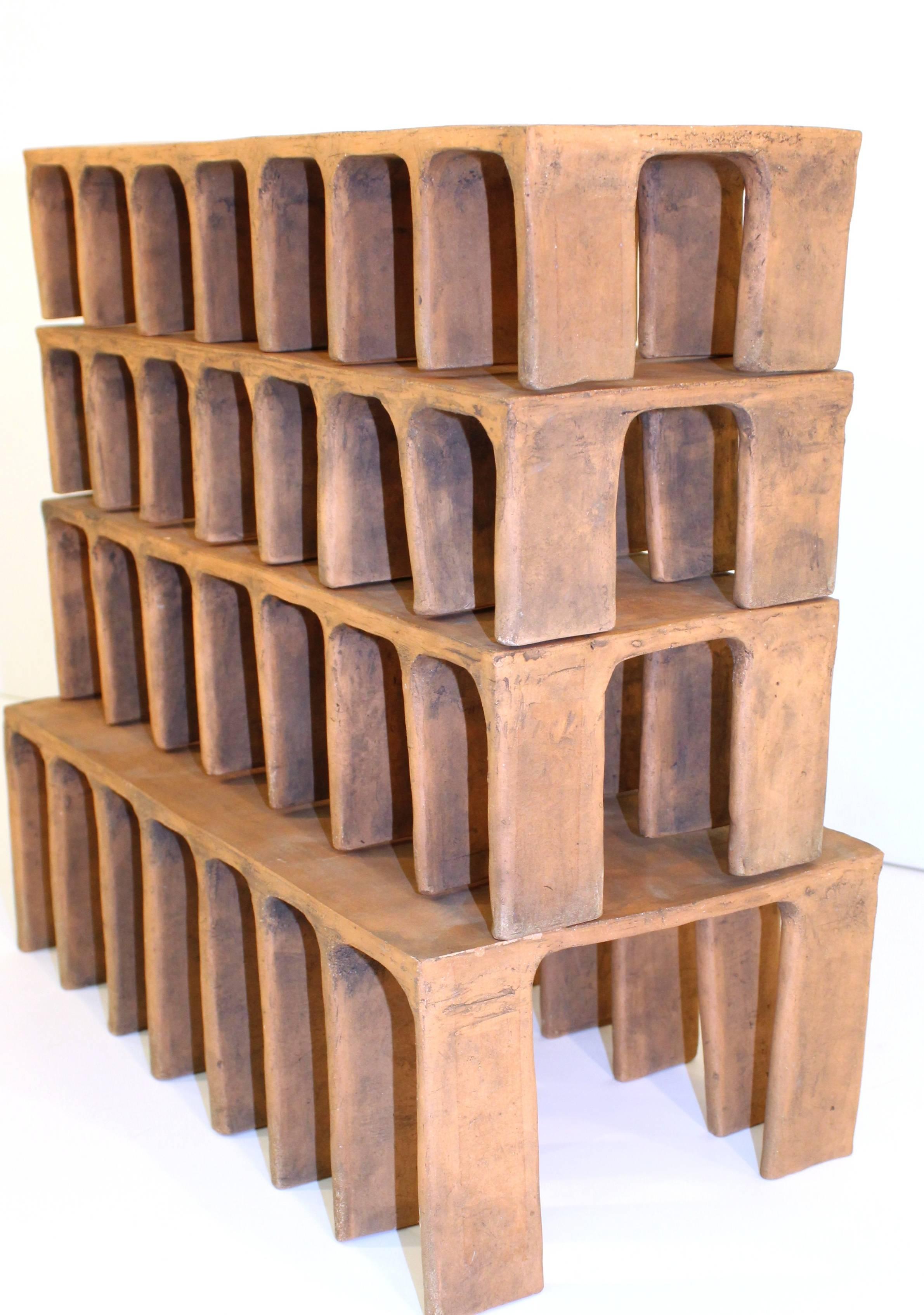 Set of architectural abstract modern sculptures by artist Irene Wheeler (American, 1917-2003), crafted of oxidized clay, produced circa 1980s, from the artist's 'Beirut' line. Excellent condition, wear consistent with age; loss of one