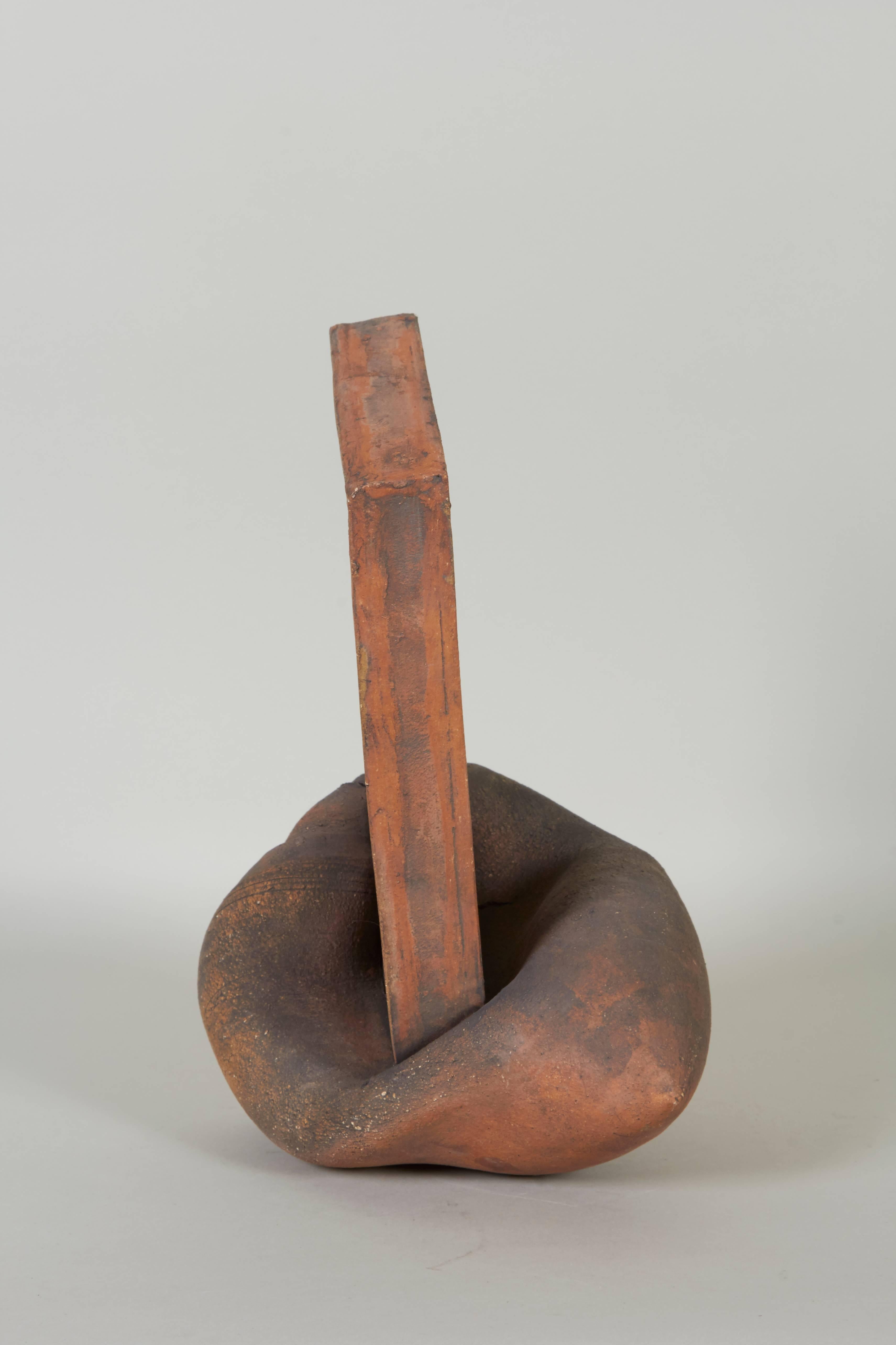 An arrangement of abstract modern fired clay constructions by Irene Wheeler (American, 1917-2003), produced circa 1970s-1980s, described as 'Hard/Soft', so-called for their contrasting linear and organic forms. Excellent condition, wear consistent
