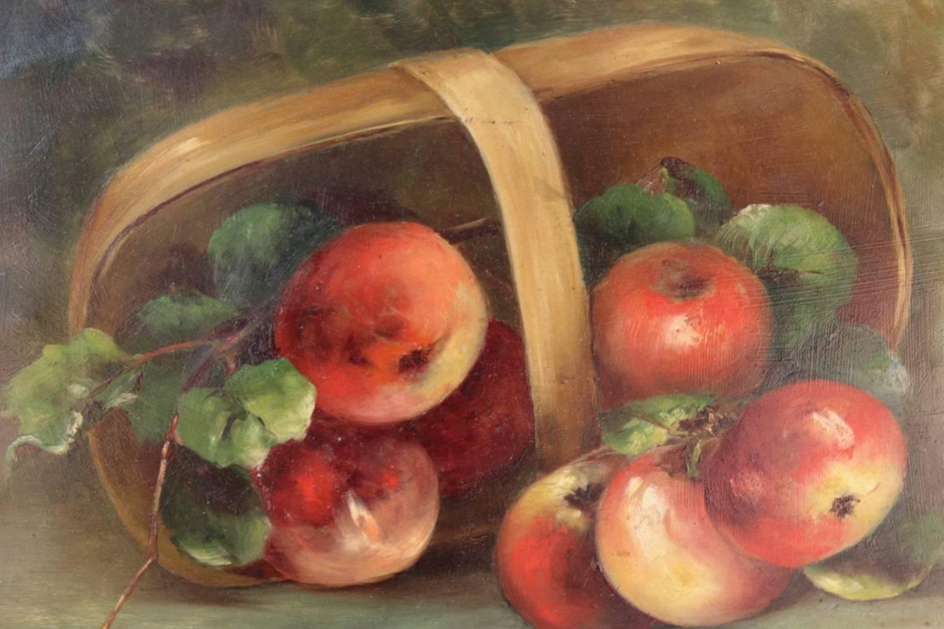 A still life painting depicting apples spilling out of a basket against a grey/green background. Signed by artist Susan E. Athearn (1865-1920). 

110335.