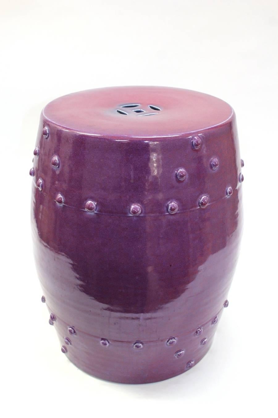 A Mid-Century ceramic garden seat in an unusual purple hue. In excellent vintage condition. 110336.

 