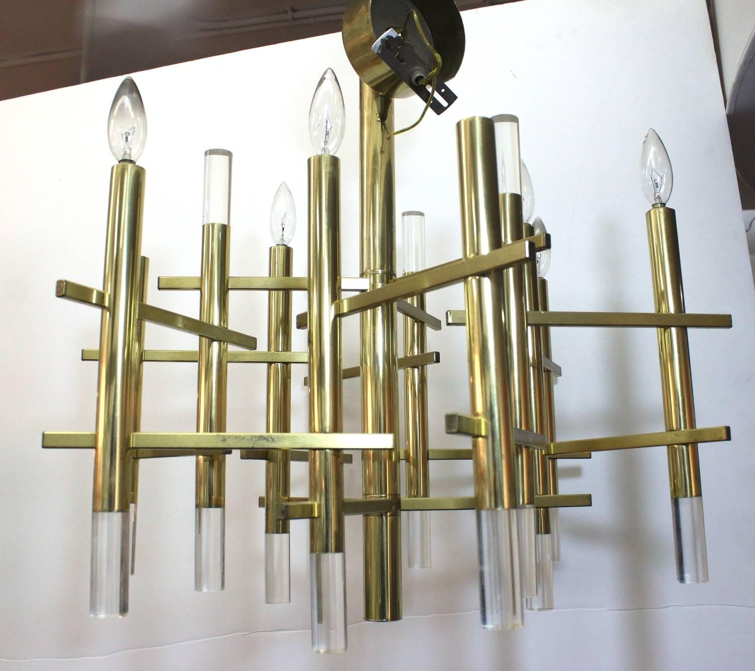 This chandelier by Gaetano Sciolari consists of linear brass elements with Lucite accents. It is in very good vintage condition. Listed height includes canopy.

110340.