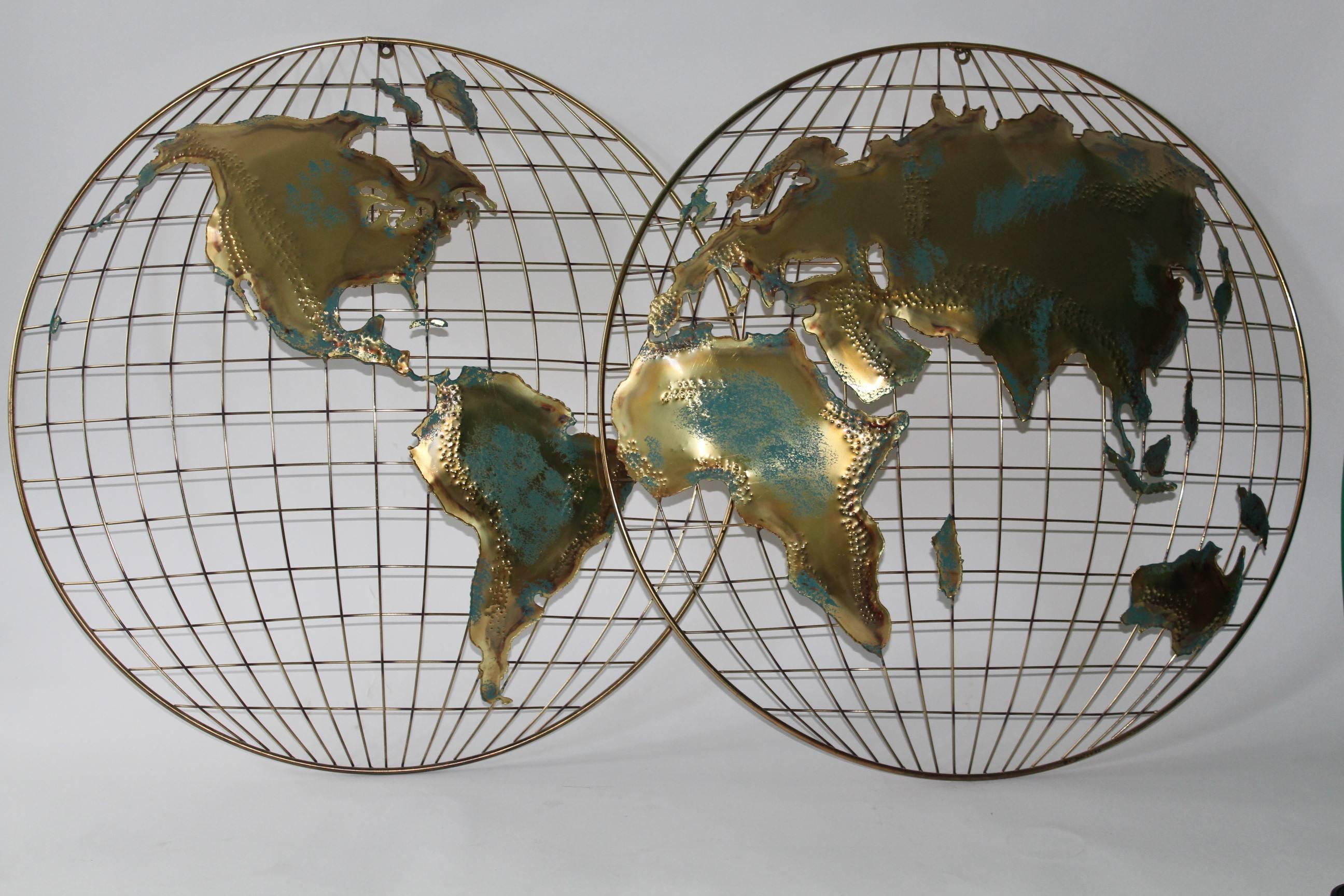 Signed pair of Brutalist manner wall mount world maps by Curtis Jere, dated 1982, crafted of torch cut and soldered mixed-metal with verdigris patina, each depicting opposite sides of the earth. Very good condition.

11095